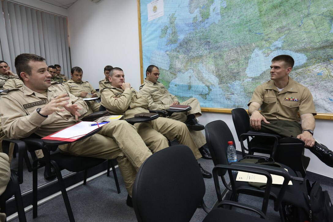 U.S. Marine Corps 1st Lt. Roddey Dowd of Black Sea Rotational Force 14 from 3rd Battalion, 8th Marine Regiment, 2nd Marine Division, answers questions during a period of instruction on combat decision making in Constanta, Romania, April 17, 2014. Black Sea Rotational Force- 14 is a contingent of Marines and sailors in the Black Sea, Balkans and Caucasus regions that work with partner nations to maintain proven partnerships while building military capacity, promoting regional stability, and providing the capability for rapid crisis response throughout Eastern Europe as directed by U.S. Marine Corps Forces Europe and Africa, U.S. European Command.