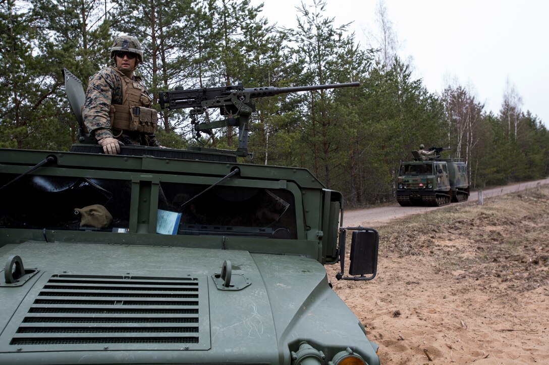 A Latvian High Mobility Multi-purpose Wheeled Vehicle carries Marines assigned to Black Sea Rotational Force 14.2 from 3rd Battalion, 8th Marine Regiment, as they execute a live fire support mission with Latvian Land Forces during Summer Shield, April 16, 2014, Camp Adazi, Latvia.  Latvia’s Anti-Armor Platoon and BSRF 14.2’s Combined Anti-Armor Team integrated forces in the fire support mission.  This is the 11th iteration of the Summer Shield exercise, a joint, staff planning and combined-arms live fire maneuver event designed to enhance the Latvian Land Force’s capacity and capability to integrate fires and maneuver at the battalion and brigade level as well as increase partner capacity, promote regional stability and continue to develop Latvian, Lithuanian, Estonian and U.S. interoperability.  (Official Marine Corps photo by Staff Sgt. Tanner M. Iskra, 2nd Marine Division Combat Camera, BSRF-14/Released)