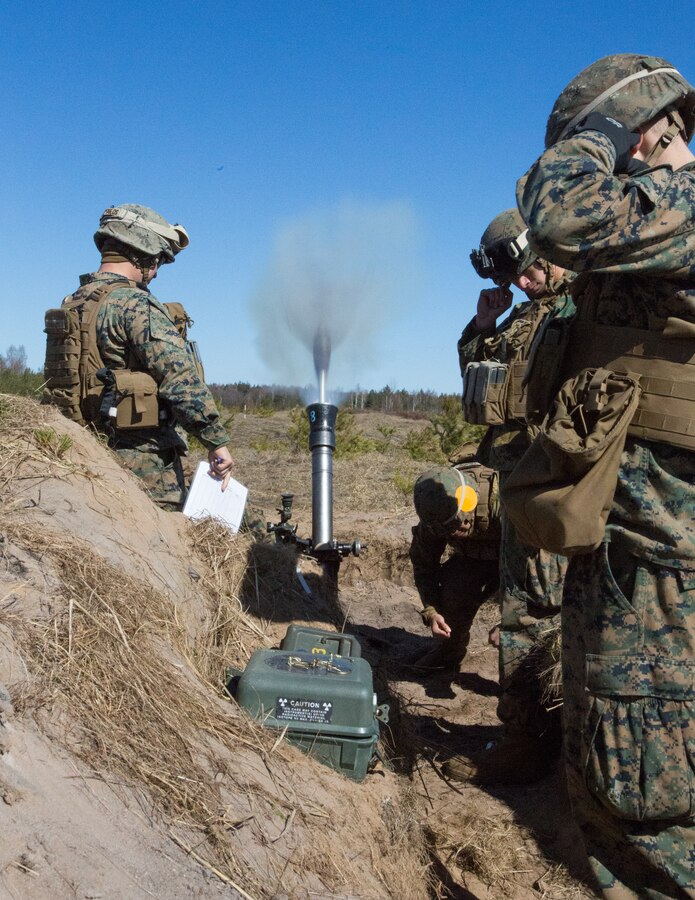 Marines with Black Sea Rotational Force 14.2 from Weapons Company, 3rd Battalion, 8th Marine Regiment, fire an 81mm high explosive round during Summer Shield, April 16, 2014, Camp Adazi, Latvia. The Marines in the live fire were a fire-support team element and worked with the Latvian Land Forces in order to synchronize an integrated attack that would use fire-support elements from three different countries.  This is the 11th iteration of the Summer Shield exercise, a joint, staff planning and combined-arms live fire maneuver event designed to enhance the Latvian Land Force’s capacity and capability to integrate fires and maneuver at the battalion and brigade level as well as increase partner capacity, promote regional stability and continue to develop Latvian, Lithuanian, Estonian and U.S. interoperability.  (Official Marine Corps photo by Staff Sgt. Tanner M. Iskra, 2nd Marine Division Combat Camera, BSRF-14/Released)