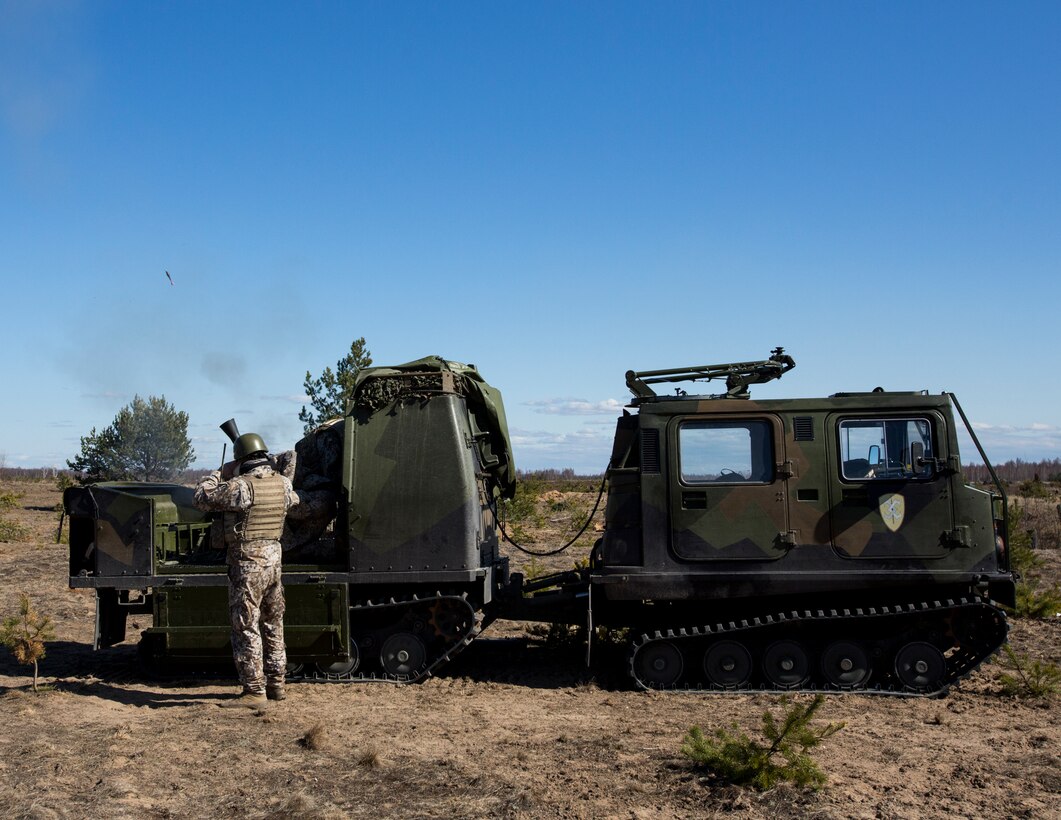 A Latvian Bandwagn 206, fires an 81mm high explosive round out of a mortar tube mounted on the rear of the vehicles during Summer Shield, April 16, 2014, Camp Adazi, Latvia.  Latvia’s 1st Fire Support Battalion were part of fire-support team element that included artillery and mortars from Estonia Defense Forces and Marines assigned to the Black Sea Rotational Force 14.2.  This is the 11th iteration of the Summer Shield exercise, a joint, staff planning and combined-arms live fire maneuver event designed to enhance the Latvian Land Force’s capacity and capability to integrate fires and maneuver at the battalion and brigade level as well as increase partner capacity, promote regional stability and continue to develop Latvian, Lithuanian, Estonian and U.S. interoperability.  (Official Marine Corps photo by Staff Sgt. Tanner M. Iskra, 2nd Marine Division Combat Camera, BSRF-14/Released)