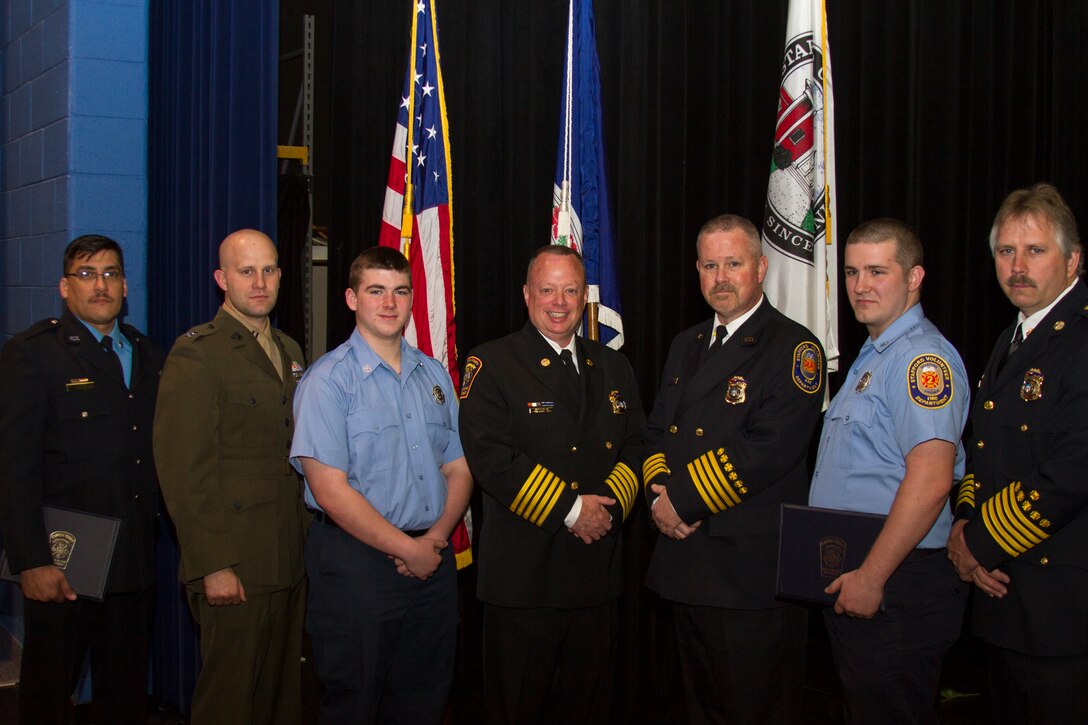 Captain Frederick Monday poses with other firefighters during the Stafford County Fire and Rescue Department Awards Ceremony on April 17. Monday accepted the Rescue Unit Citation Award on behalf of Station 2 on April 17 for assisting a Stafford County resident in delivering a baby at her residence on December 29, 2013. Monday, a Burtonsville, Md. native, is a volunteer for the Stafford Volunteer Fire Department, Station 2.
