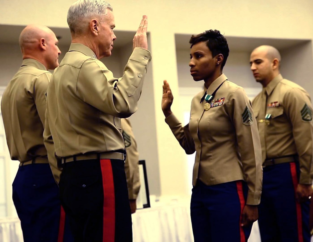 Staff Sgt. Iasia J. Brown, canvassing recruiter, Recruiting Station (RS) Los Angeles, receives a meritorious promotion from Gen. James F. Amos, Commandant of the Marine Corps, during a ceremony, here, Feb. 4. In fiscal year 2013, Brown proved her dedication to finding the most physically, mentally and morally fit individuals to become Marines. Her outstanding work ethic earned her the title of Marine Corps Recruiting Command non-prior service recruiter of the year for FY13.

(Marine Corps photo by Lance Cpl. Francisco Martinez)
 