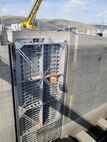 Personnel work platforms and fall-protection systems were installed April 15 in preparation for diagonal tensioning work. 