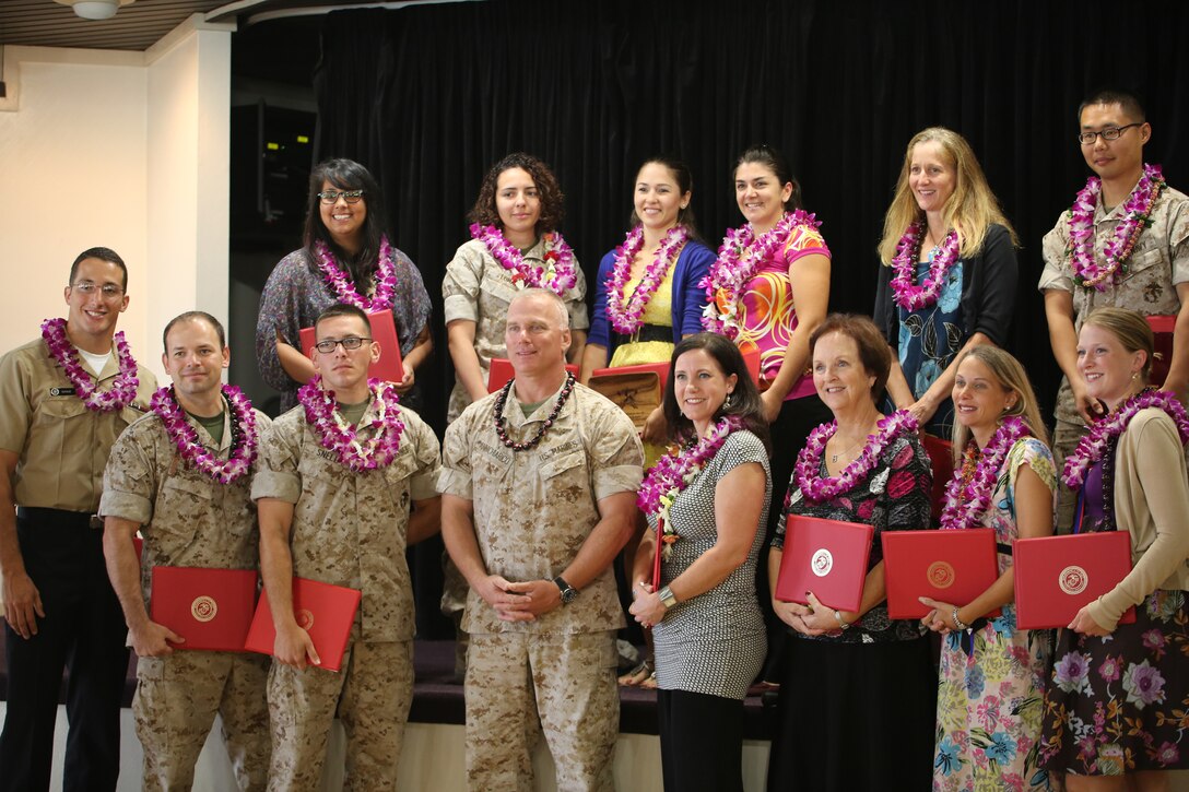 The nominees for 2014 volunteer of the year stand with Col. Brian P. Annichiarico, commanding officer of MCB Hawaii, during the 2014 Volunteer Recognition Ceremony at the Lanai Ballroom in the Officers’ Club, April 4, 2014. (U.S. Marine Corps photo by Lance Cpl. Suzanna Knotts)