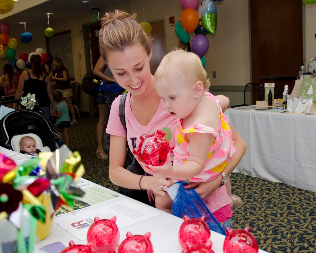 Allie Cloud visits the Keiki Aloha Expo with her 14-month-old daughter, Brena, in the Fairways Ballroom, April 11, 2014. (U.S. Marine Corps photo by Kristen Wong)