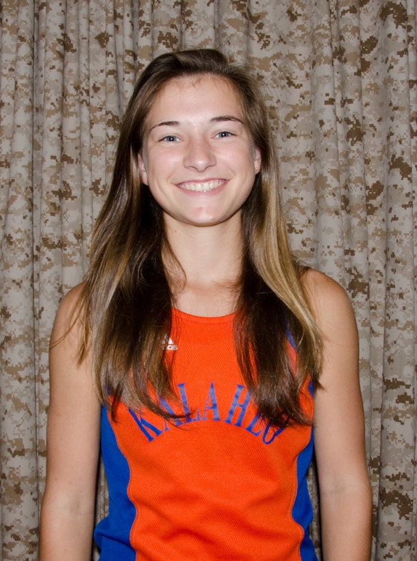 Percie Lyons, an 11th-grader, received first place in the Girls 800, 1,500 and 3,000-Meter Run Varsity events during the 2014 Oahu Interscholastic Association Varsity Eastern Division Track Championship at Kaiser High School in Honolulu, April 5. The 17-year-old athlete ran 2 minutes, 34.36 seconds in the 800-meter, 5 minutes, 13.59 seconds in the 1,500-meter and 11 minutes, 41.46 seconds in the 3,000-meter. Although she was happy with her scores, Lyons said she eventually hopes to bring her 1,500-meter time down to 5 minutes, 8 seconds. “The girls got second overall and the boys got first,” she said. “I was proud of our team for coming together and doing that (well).” Lyons competed in the April 17 Punahou Relays and will also compete in the OIA Varsity Championships May 1 and 3. She is already qualified to compete in the Hawaii High School Athletic Association Championship. (U.S. Marine Corps photo by Kristen Wong)