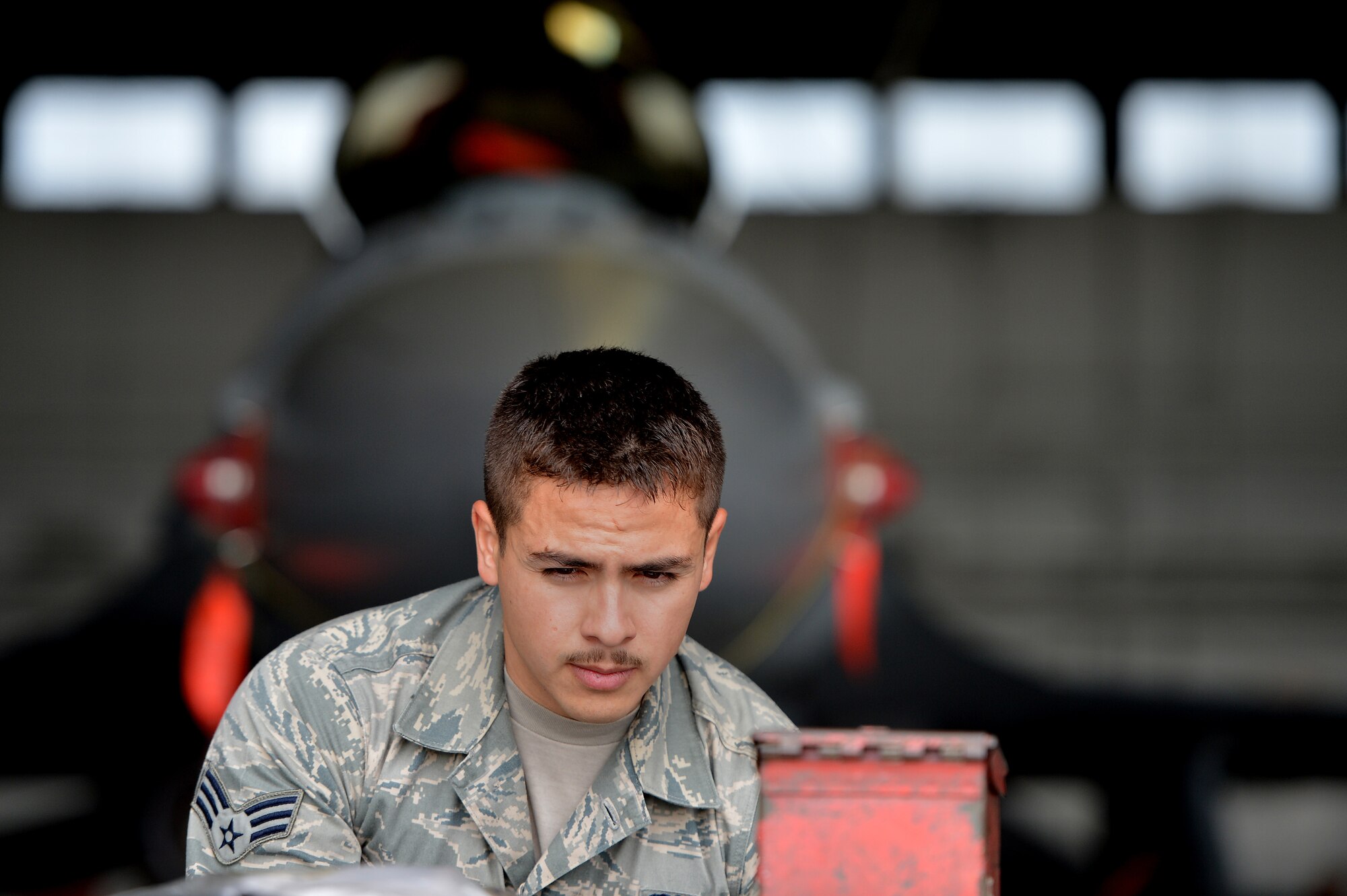 U.S. Air Force Senior Airman Noel Santoyo, 20th Maintenance Group weapons load crew member, gathers tools from a tool cart during a load crew of the year competition, April 18, 2014, Shaw Air Force Base, S.C. The 20th Fighter Wing weapons standardization unit held the annual competition which brings together weapons load crew members from all three fighter squadrons at Shaw to compete against each other. The competition showcases Airmen’s skills and job knowledge while also building camaraderie amongst the units. (U.S. Air Force photo by Staff Sgt. Kenny Holston/Released)