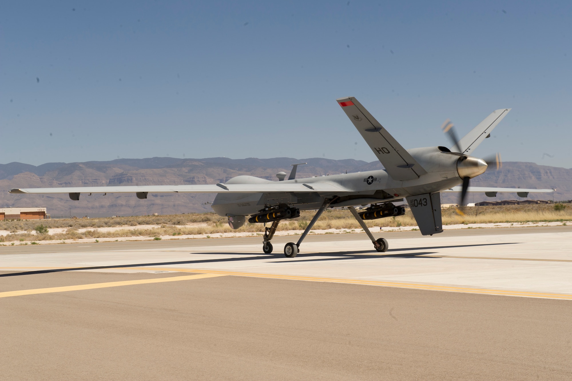 An MQ-9 Reaper prepares to take off at Holloman Air Force Base, N.M., April 16. The MQ-9 Reaper was loaded with live ammunitions in preparation for real world applications. (U.S. Air Force photo by Staff Sgt. E’Lysia Wray/Released)