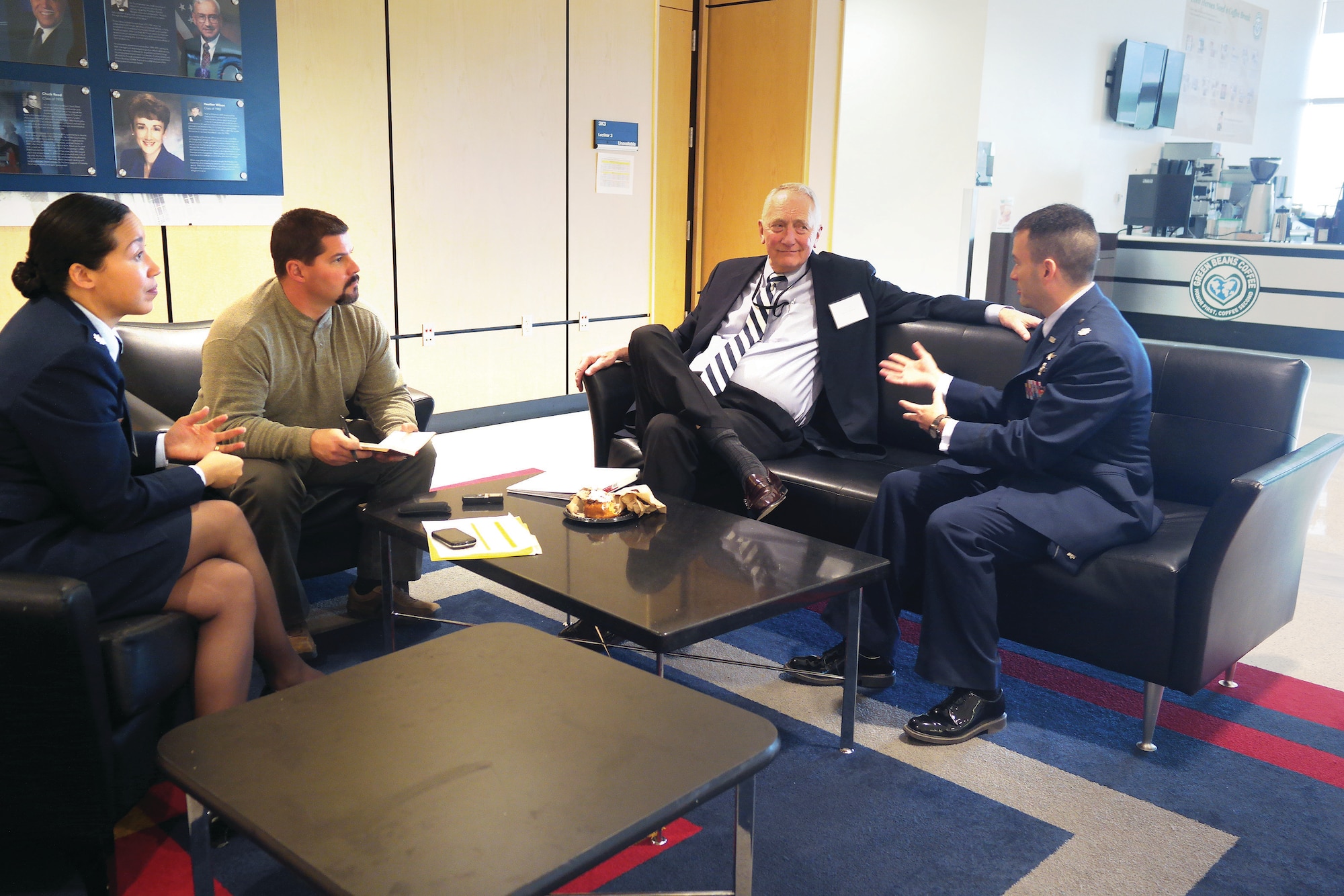 Retired Lt. Gen. Erwin Rokke (middle), Lt. Col. Candice Pipes and Lt. Col Mario Serna talk about the benefits of undergraduate research collaborations, such as the Colorado Springs Undergraduate Research Forum with Gazette reporter Mike Humphries here April 12. (Amy Gillentine/U.S. Air Force photo)