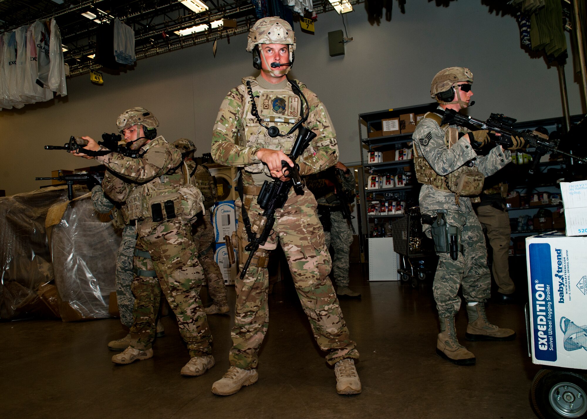 49th Security Forces Squadron special reaction force team members respond to the active shooter exercise as additional support inside the Base Exchange at Holloman Air Force Base, N.M., April 17. Holloman maintains readiness to respond to emergencies such as active shooters by conducting training exercises multiple times a year.  The 49th SFS and the 49th Civil Engineer Squadron were able to quickly respond to the exercise scenario, neutralize the threats and evacuate the victims. (U.S. Air Force photo by Senior Airman Daniel Liddicoet/Released)