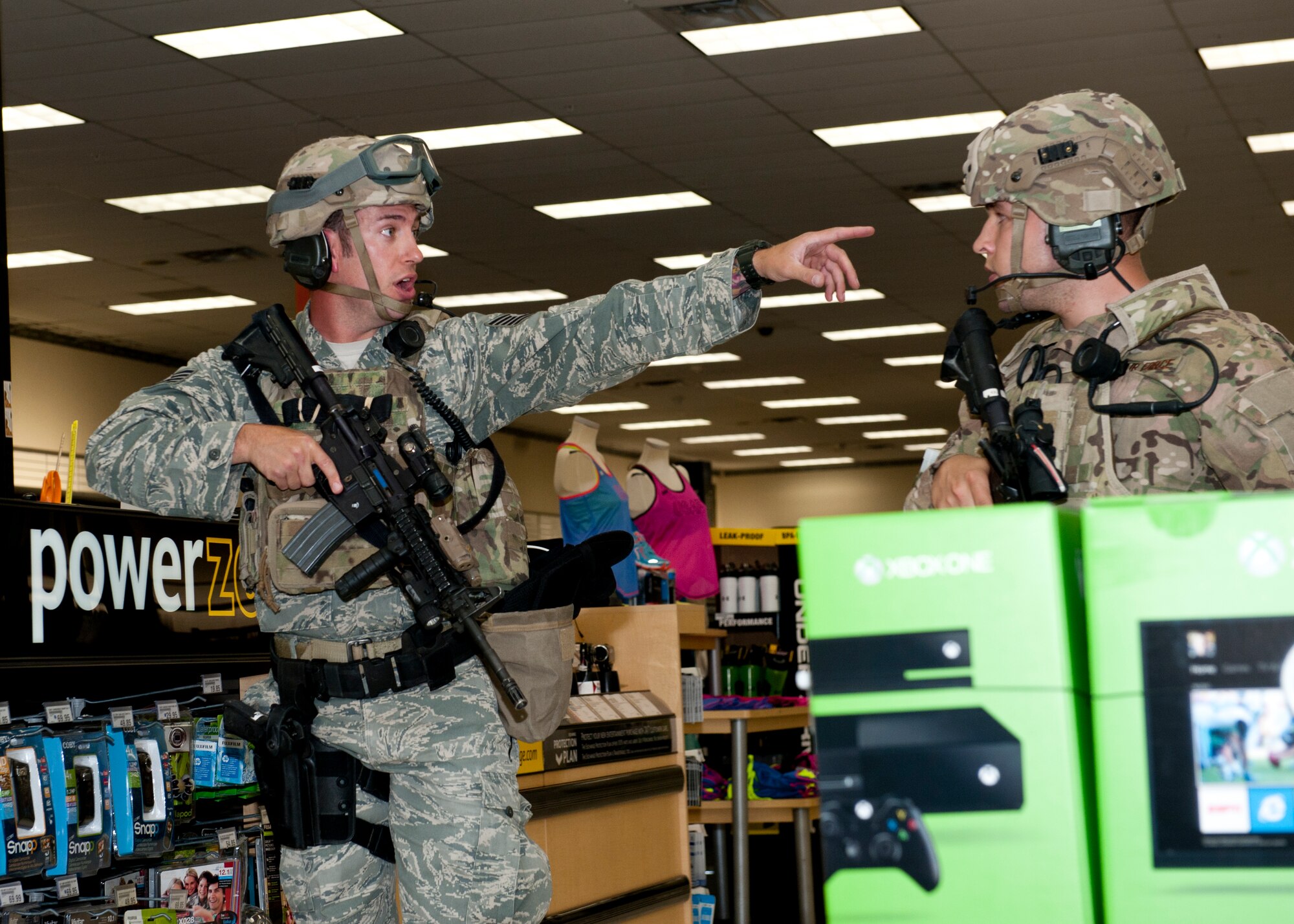 49th Security Forces Squadron special reaction force team members respond to the active shooter exercise to provide additional support inside the Base Exchange at Holloman Air Force Base, N.M., April 17. Holloman maintains readiness to respond to emergencies such as active shooters by conducting training exercises multiple times a year.  The 49th SFS and the 49th Civil Engineer Squadron were able to quickly respond to the exercise scenario, neutralize the threats and evacuate the victims. (U.S. Air Force photo by Senior Airman Daniel Liddicoet/Released)