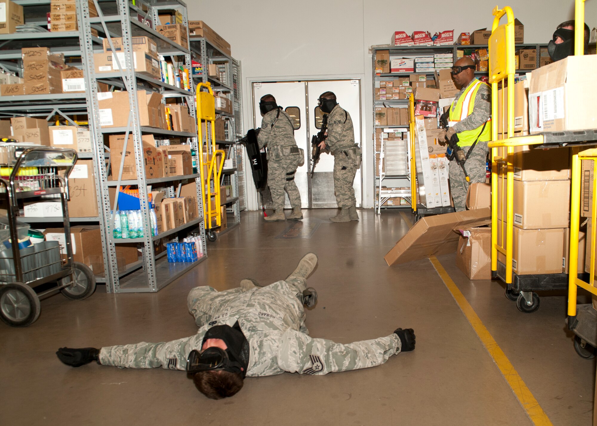 49th Security Forces Squadron patrolmen respond to the active shooter exercise inside the Base Exchange at Holloman Air Force Base, N.M., April 17. Holloman maintains readiness to respond to emergencies such as active shooters by conducting training exercises multiple times a year.  The 49th SFS and the 49th Civil Engineer Squadron were able to quickly respond to the exercise scenario, neutralize the threats and evacuate the victims. (U.S. Air Force photo by Senior Airman Daniel Liddicoet/Released)