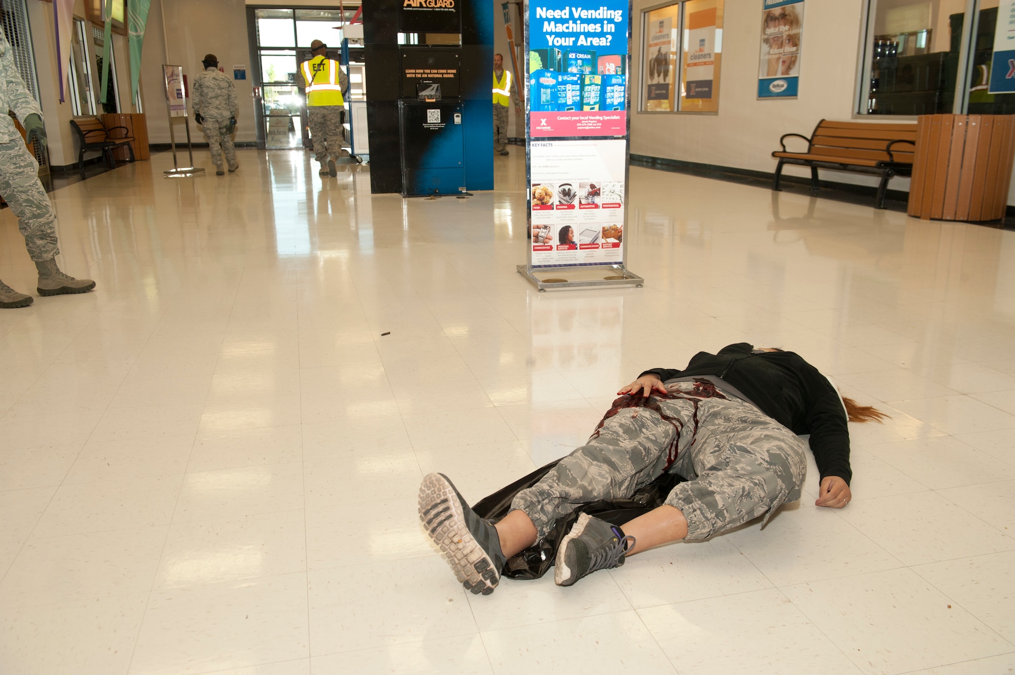 A victim participant simulates an injury inside the Base Exchange during an active shooter exercise on Holloman Air Force Base, N.M., April  17. Holloman maintains readiness to respond to emergencies such as active shooters by conducting training exercises multiple times a year.  The 49th Security Forces Squadron and the 49th Civil Engineer Squadron were able to quickly respond to the exercise scenario, neutralize the threats and evacuate the victims. (U.S. Air Force photo by Senior Airman Daniel Liddicoet/Released)