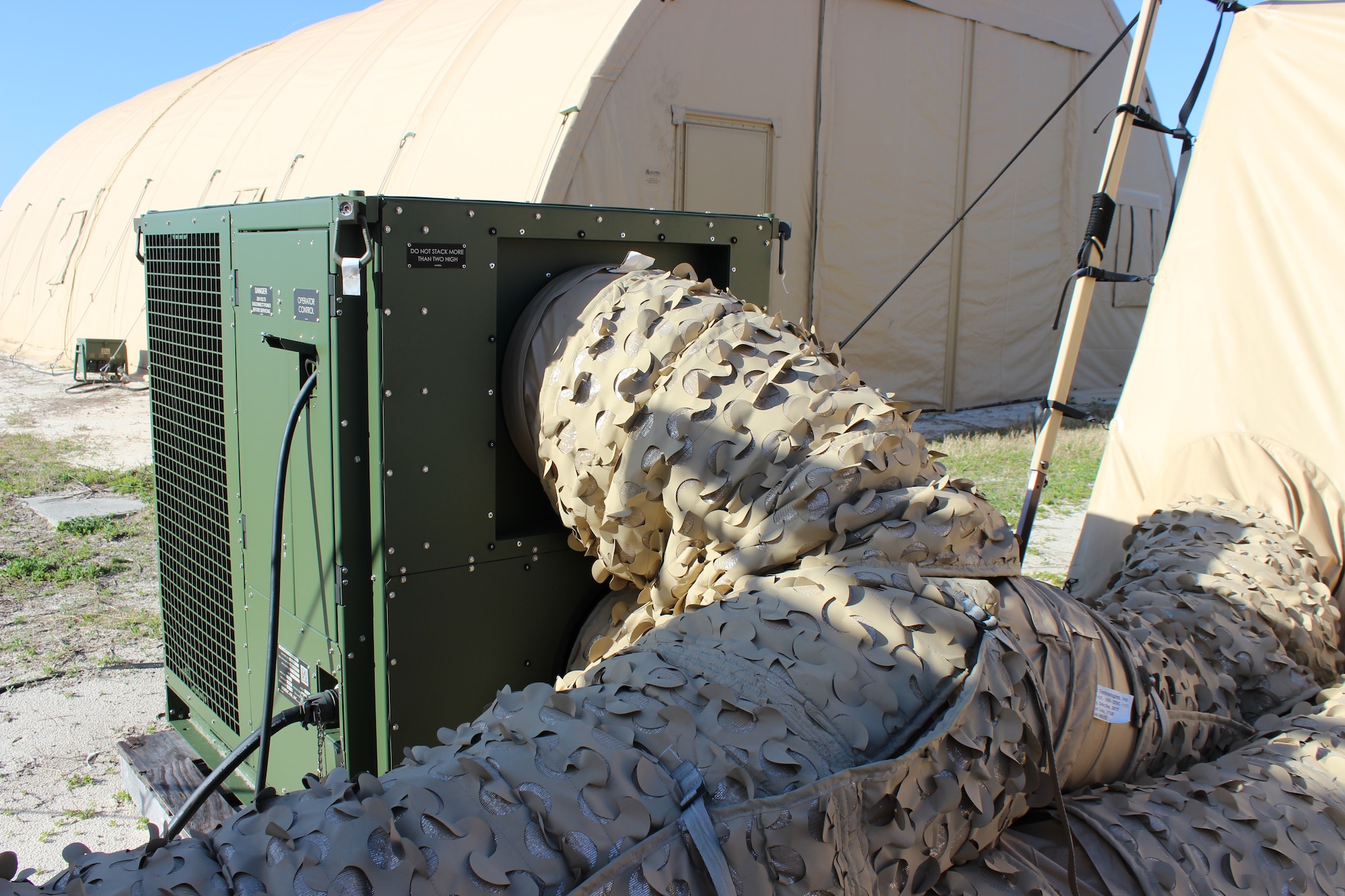 New energy-efficient environmental control units like this one on display at Tyndall Air Force Base, Fla., have a thermal coating and insulated ducts that can help the Air Force cut its expeditionary facility energy use by more than 60 percent when used to heat and cool shelters in deployed locations. (U.S. Air Force photo/Jennifer McCabe)