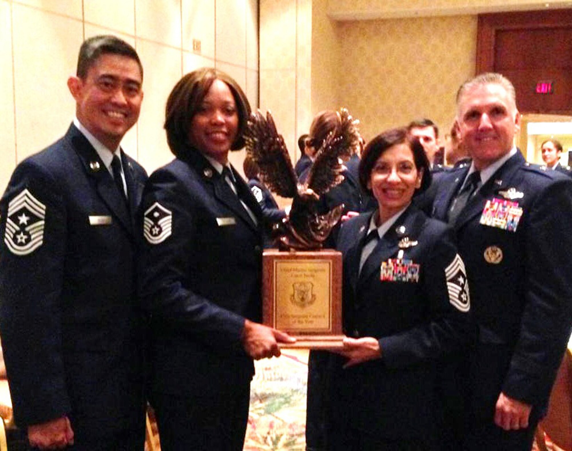 Pictured here with the First Sergeant Council of the Year trophy are, left to right: Chief Master Sgt. Brian Wong, 4th Air Force command chief, Master Sgt. Doris Phillips, 945th Aircraft Maintenance Squadron first sergeant, Chief Master Sgt. Ericka Kelly, 349th AMW command chief, and Brig. Gen. John Flournoy, 4th AF commander. (Courtesy photo)

