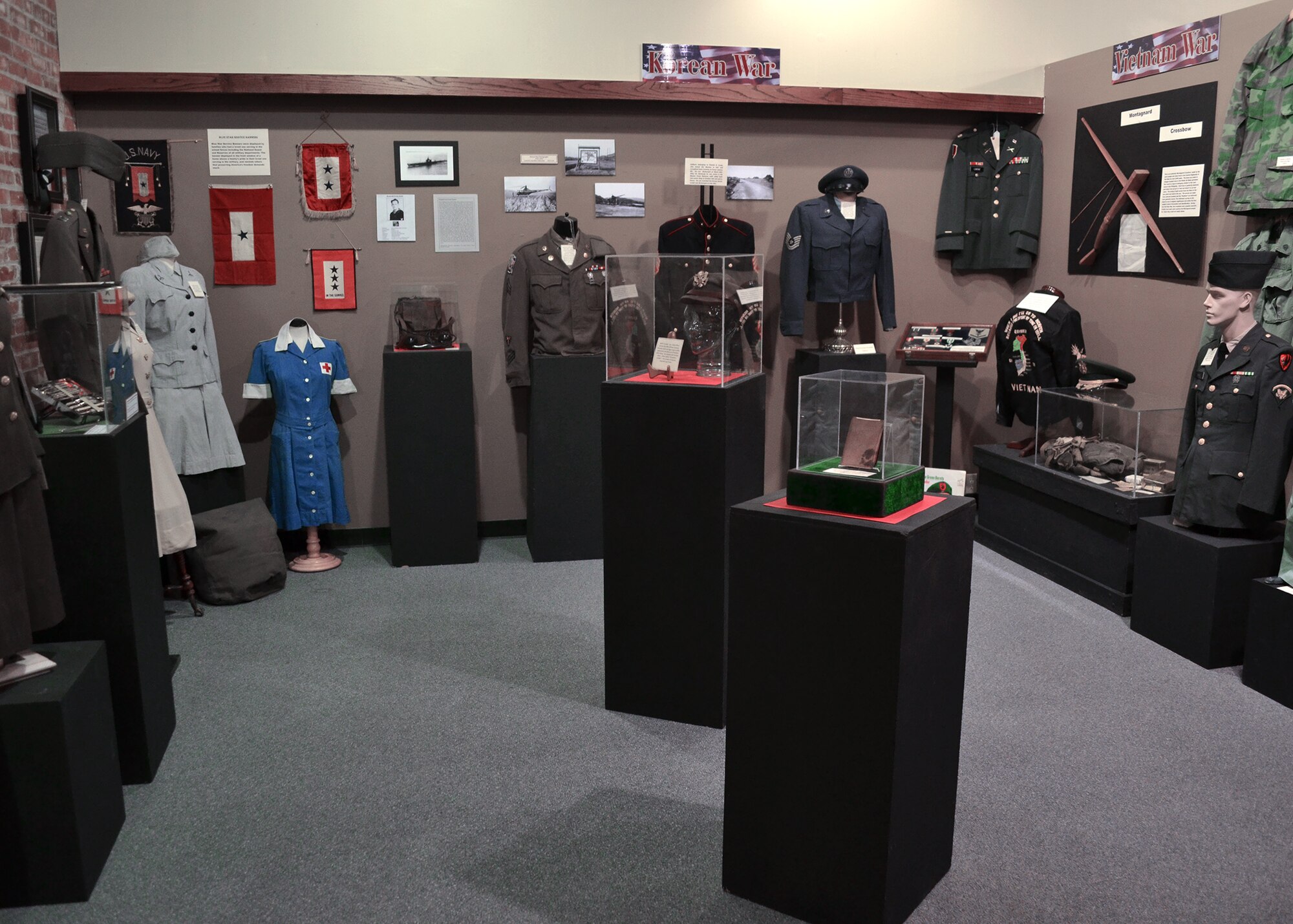 Pictured is a display of various military uniforms and memorabilia used throughout the United States at The History Museum in Great Falls, Mont. The History Museum showcases the history of Central Montana and includes farming equipment, women’s fashion, architectural models and many other displays. (U.S. Air Force photo/Senior Airman Cortney Paxton)