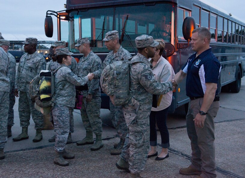 Airmen from the 824th Base Defense Squadron shake hands with Moody leadership before boarding buses to deploy at Moody Air Force Base, Ga., April 17, 2014. The 824th BDS building was the Airmen’s last stop before leaving Moody for Southwest Asia. (U.S. Air Force photo by Airman Dillian Bamman/Released)