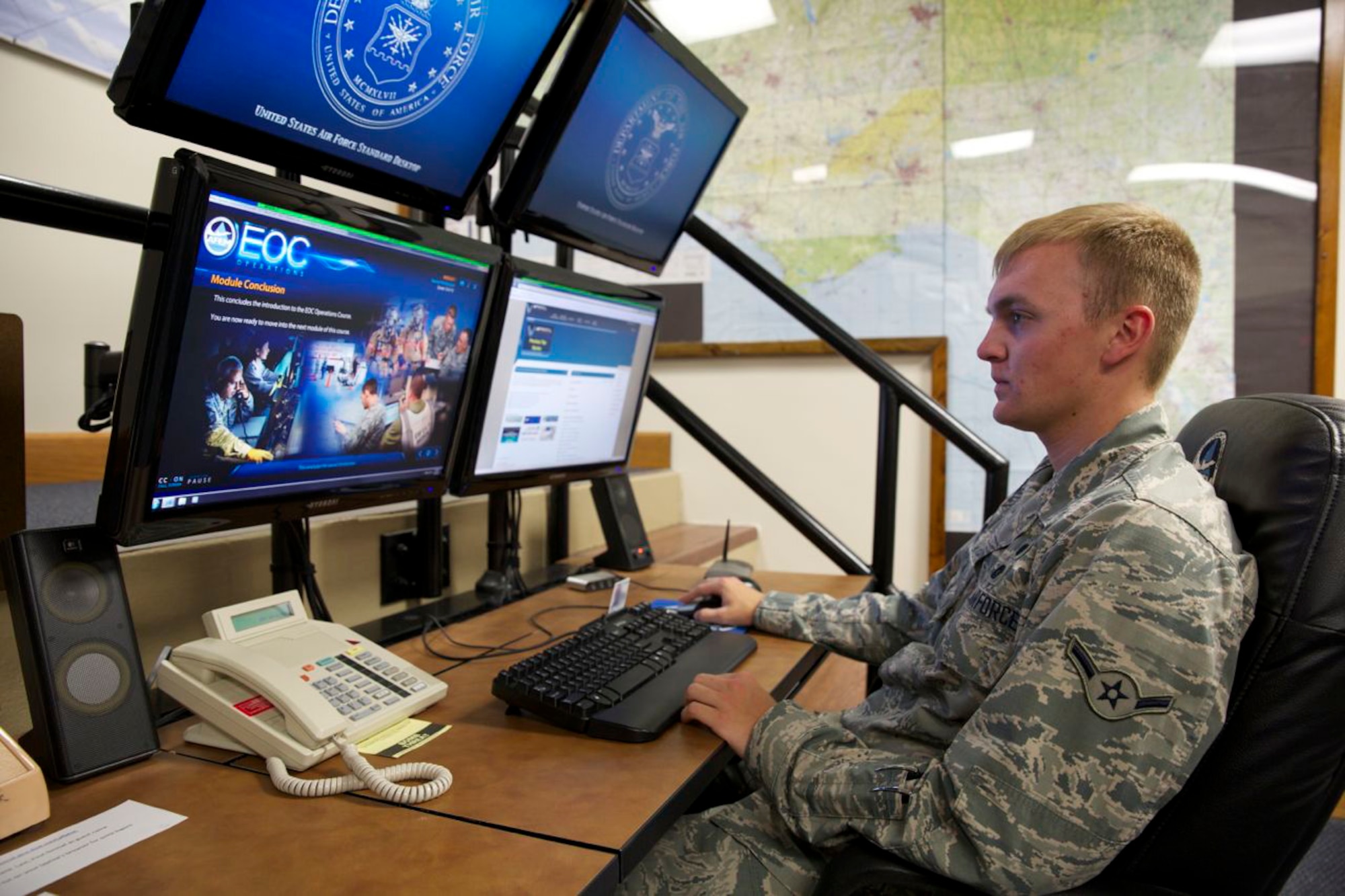 Airman Cody Moccia with the emergency management operations element of the 325th Civil Engineer Squadron, Tyndall Air Force Base, Fla., reviews the newly updated Emergency Operations Center web-based training course. The EOC Operations course is one of seven that training experts at the Air Force Civil Engineer Center are updating to improve the way the information is presented and reduce training time and costs. (U.S. Air Force photo/Eddie Green)