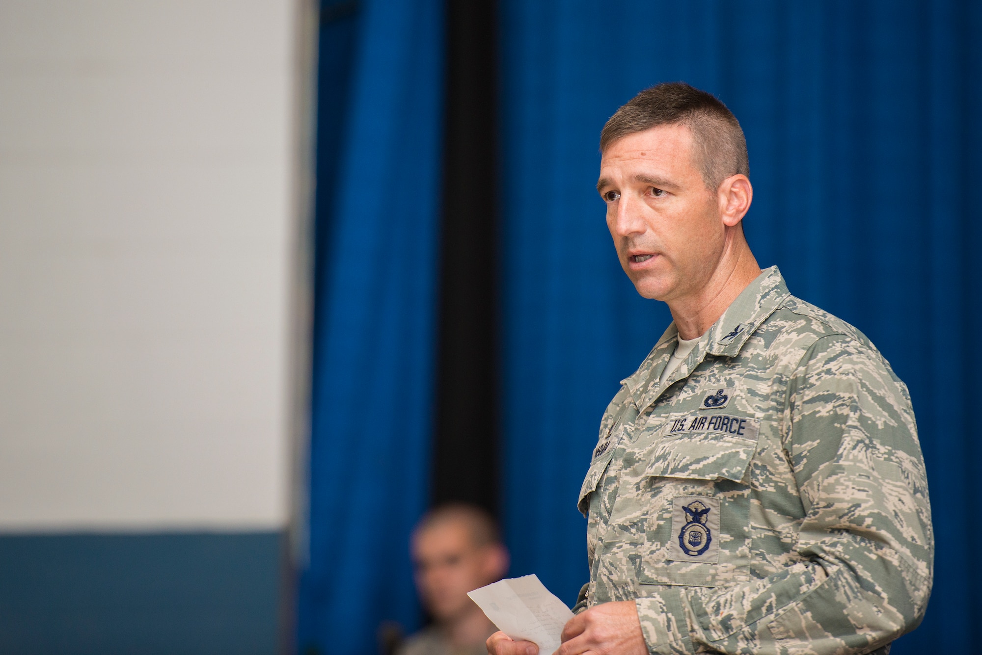 U.S. Air Force Col. Paul Kasuda, 820th Base Defense Group commander, speaks prior to an awards presentation at Moody Air Force Base, Ga., April 17, 2014. Kasuda spoke about the significance of the awards and the sacrifice required to earn them. (U.S. Air Force photo by Airman 1st Class Ryan Callaghan/Released)