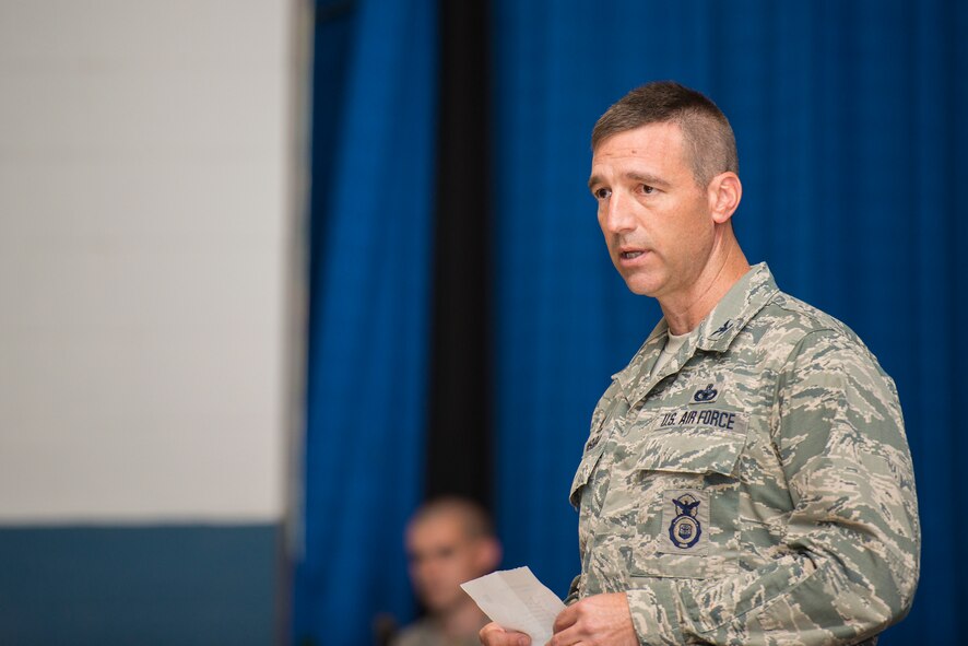 U.S. Air Force Col. Paul Kasuda, 820th Base Defense Group commander, speaks prior to an awards presentation at Moody Air Force Base, Ga., April 17, 2014. Kasuda spoke about the significance of the awards and the sacrifice required to earn them. (U.S. Air Force photo by Airman 1st Class Ryan Callaghan/Released)