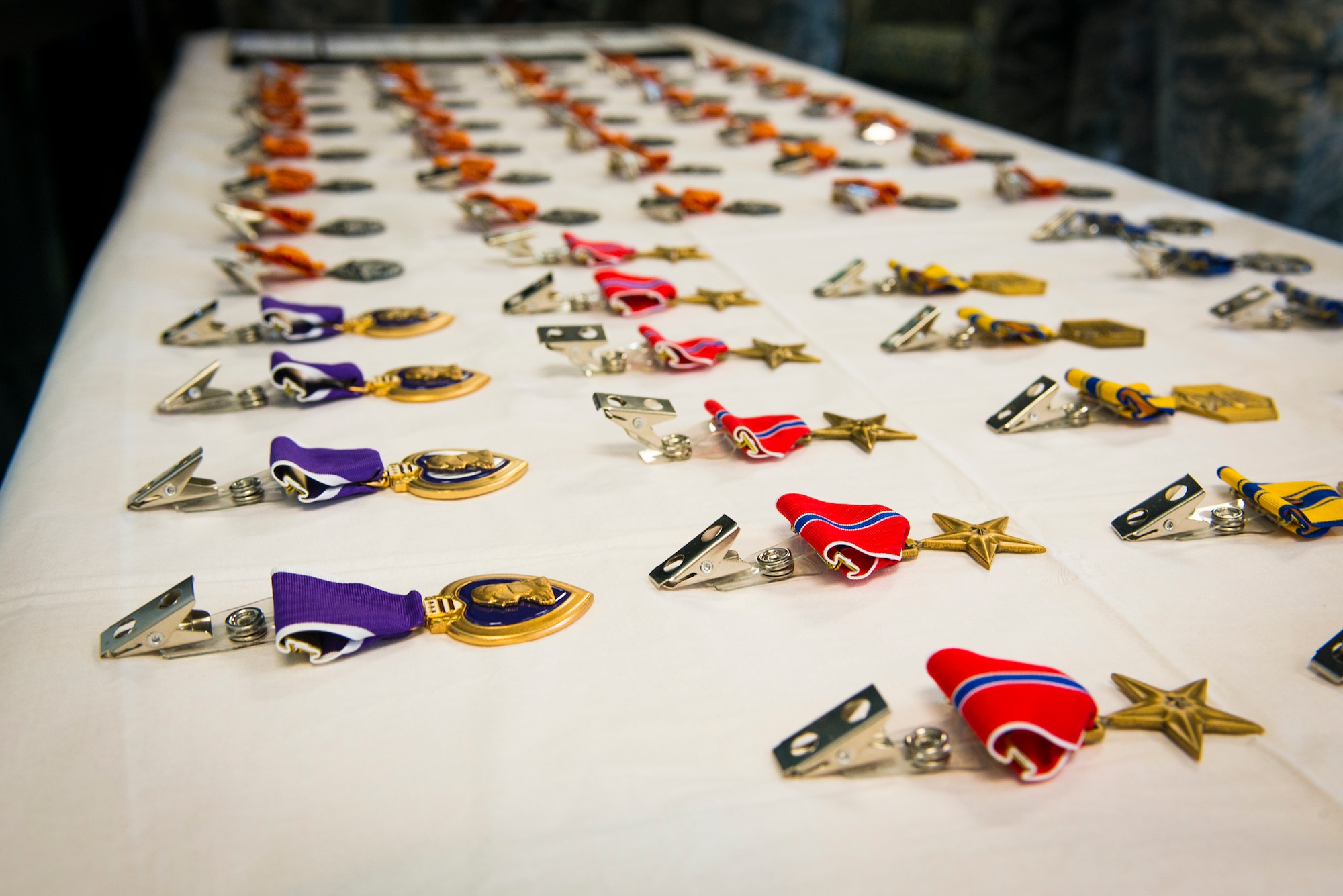 Medals are displayed prior to an awards presentation at Moody Air Force Base, Ga., April 17, 2014. Four Purple Heart Medals, seven Bronze Star Medals, six Air Force Commendation Medals, six Air Force Achievement Medals and 41 Combat Action Medals were awarded to Airmen from the 820th Base Defense Group after returning from a recent deployment. (U.S. Air Force photo by Airman 1st Class Ryan Callaghan/Released)