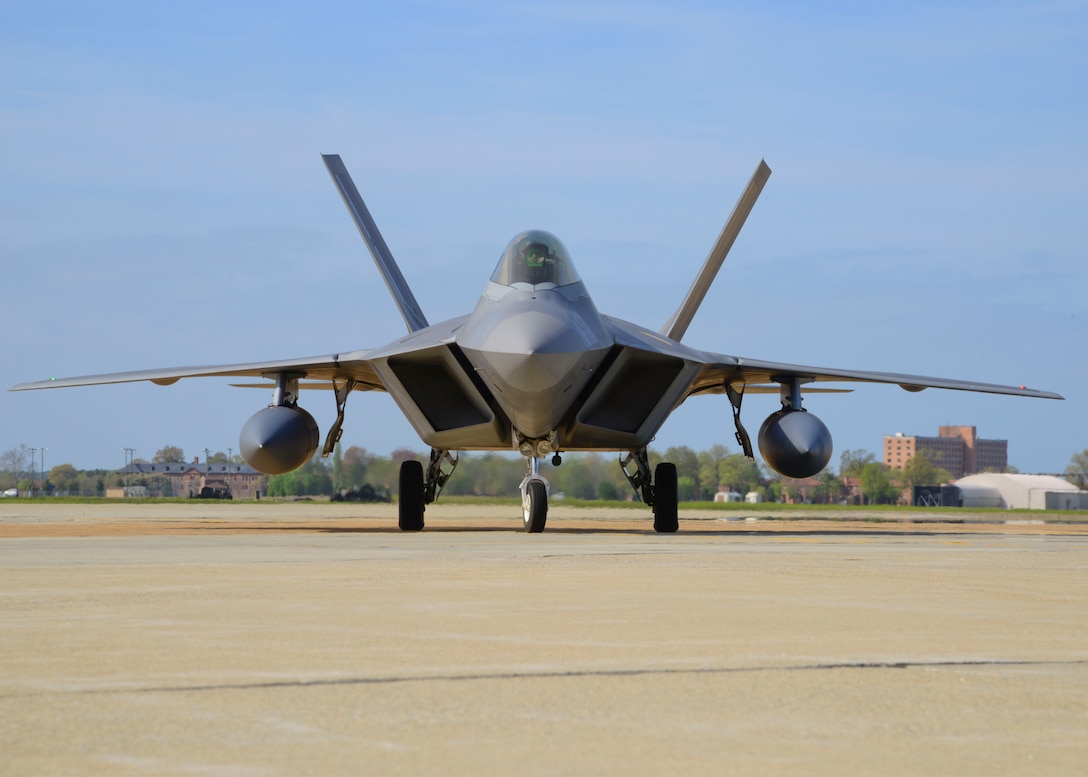 An F-22 Raptor assigned to the 94th Fighter Squadron taxis in after nearly a four-month deployment at Langley Air Force Base, Va., April 17, 2014. F-22 Raptors and about 300 Airmen from the 1st Fighter Wing and the Virginia Air National Guard's 192nd FW deployed to Kadena Air Base, Japan, on a rotation to provide stability and security while allowing units to integrate with U.S. and Japanese forces. (U.S. Air Force photo by Staff Sgt. Antoinette Gibson/Released)