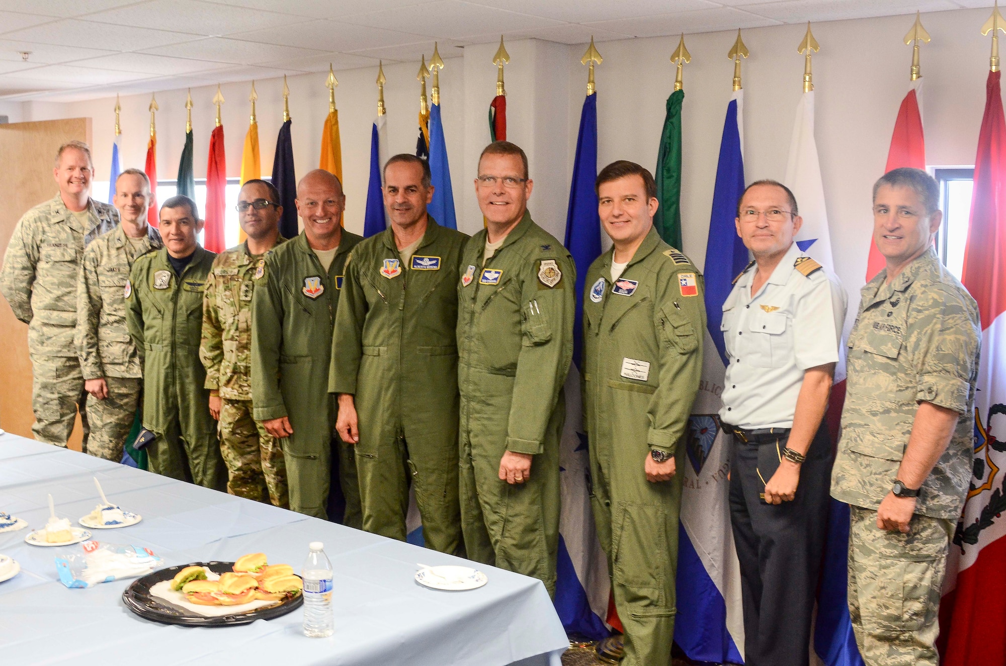 Members from 12th Air Force (Air Forces Southern) and gather for a photo during the 53rd Anniversary of the System of Cooperation Among American Air Forces (SICOFAA) at Davis-Monthan Air Force Base, Ariz., Apr. 16, 2014.  SICOFAA is the system that puts action to CONJEFAMER, a secretariat. The permanent secretariat was started in 1965 and since then the U.S. Air Force has hosted it, although it can be hosted by any nation. Every four to five years it comes up for renewal. Currently, the deputy secretary general position rotates amongst the other 20 Air Forces for two year tours in alphabetical order of the country they represent.  (U.S. Air Force photo by Staff Sgt. Adam Grant/Released)