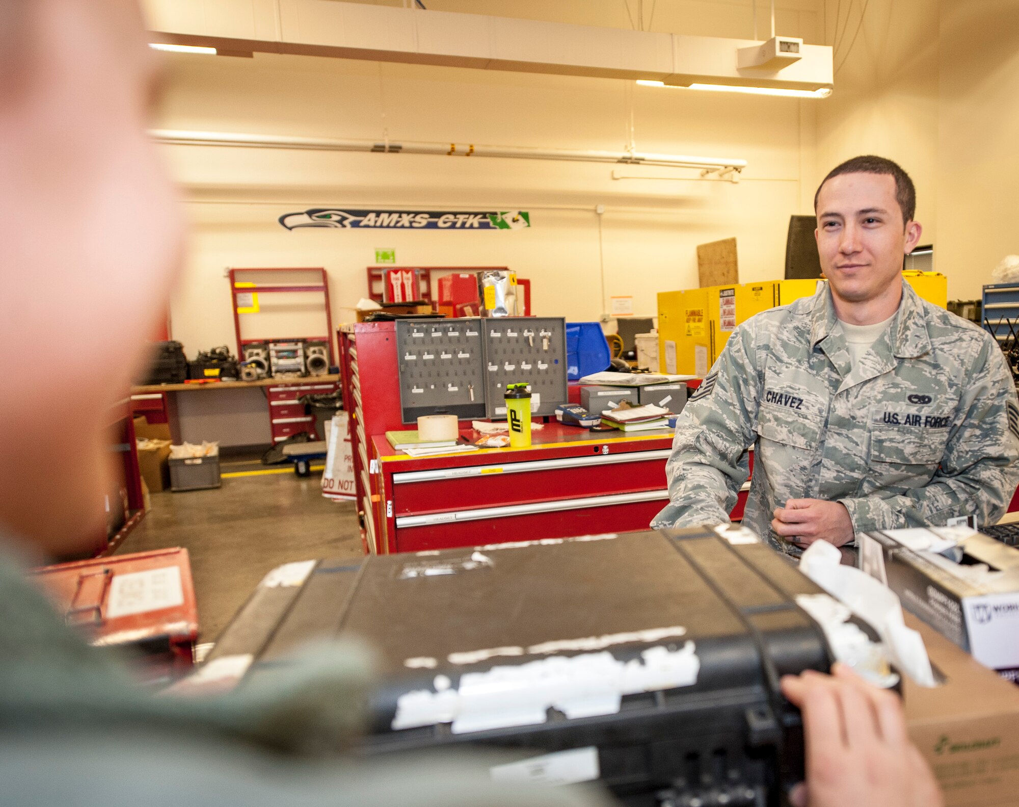 Staff Sgt. David Chavez assists Senior Airman Shelby Kenny as she checks out tools from the 92nd Aircraft Maintenance Squadron’s consolidated tool kit at Fairchild Air Force Base, Wash., April 16, 2014. The 92nd AMXS CTK shop handles an average of nearly 5,000 tools every day. Chavez is a 92nd AMXS CTK technician from Yucaipa, Calif., and Kenny is a 92nd AMXS electrical and environmental specialist from Sioux Falls, S.D. (U.S. Air Force photo by Staff Sgt. Benjamin W. Stratton/Released)