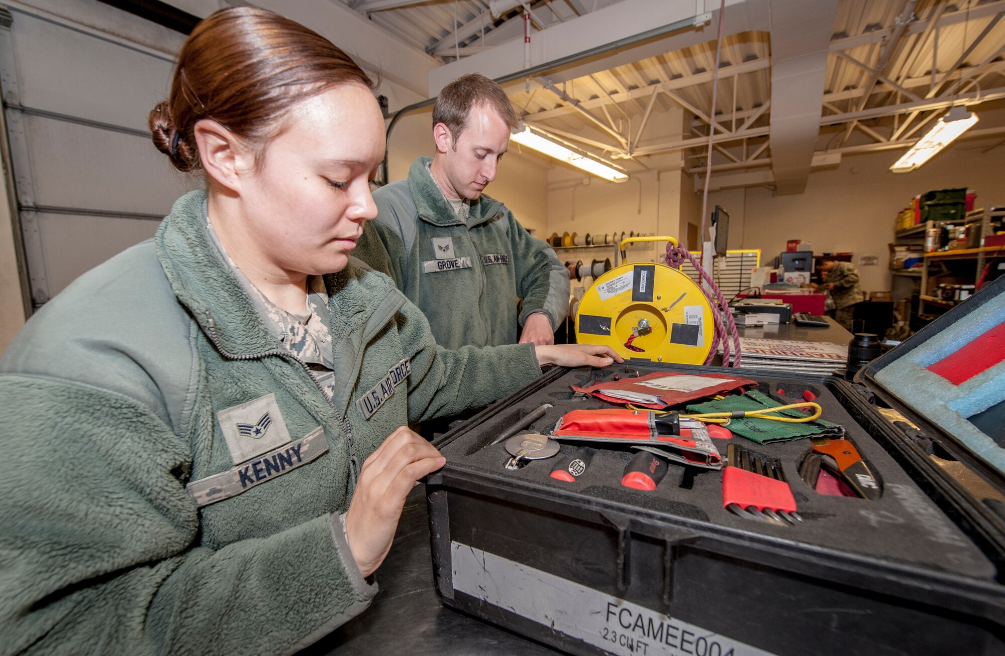 Senior Airmen Shelby Kenny and David Grove inventory their tools before signing them out for duty from the 92nd Aircraft Maintenance Squadron’s consolidated tool kit at Fairchild Air Force Base, Wash., April 16, 2014. The 92nd AMXS CTK shop handles an average of nearly 5,000 tools every day. Kenny and Grove are 92nd AMXS electrical and environmental specialists. Kenny hales from Sioux Falls, S.D., and Grove is a Springfield, Ill., native. (U.S. Air Force photo by Staff Sgt. Benjamin W. Stratton/Released)