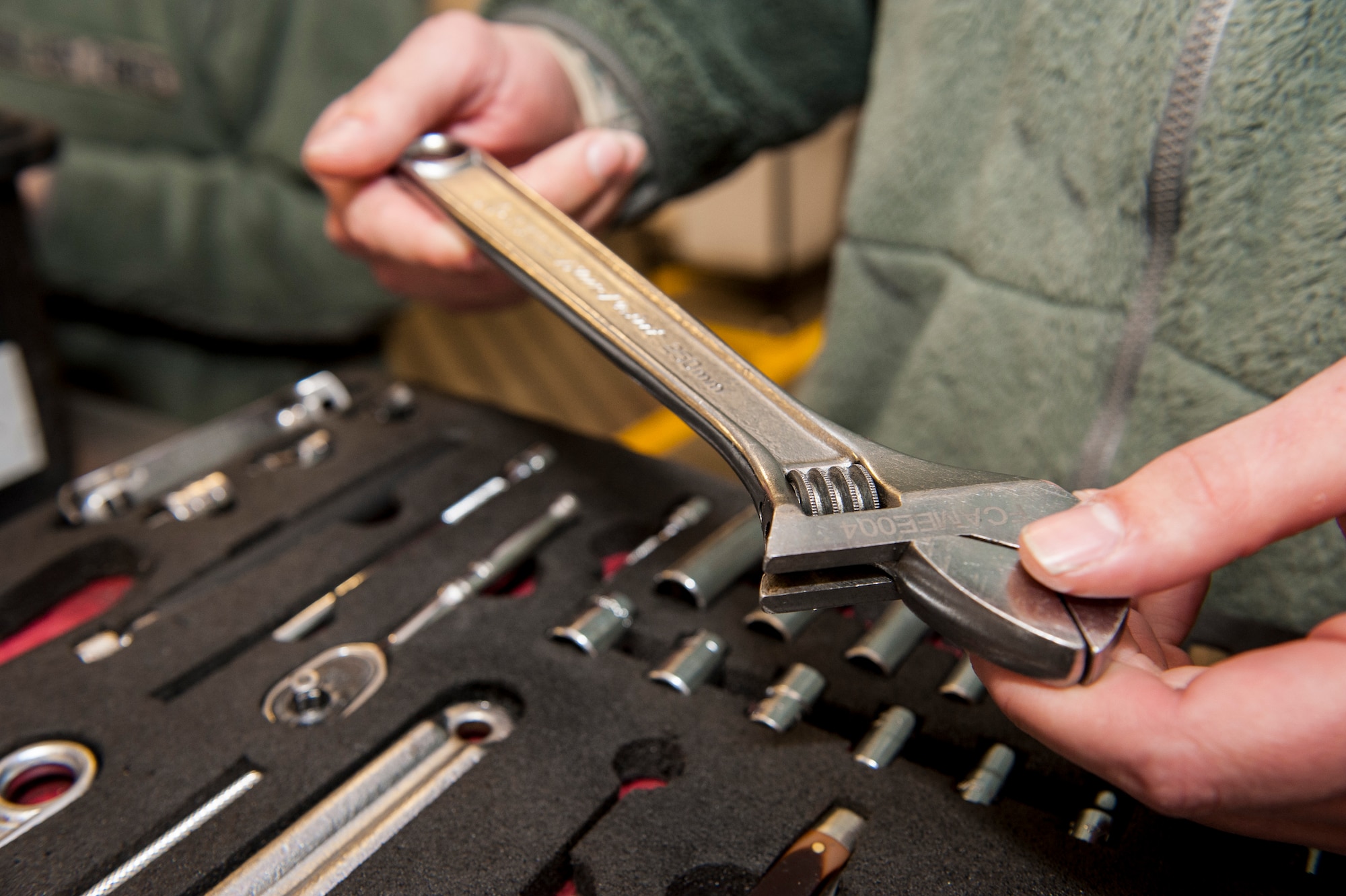 Senior Airman David Grove inventories his tools before signing them out for duty from the 92nd Aircraft Maintenance Squadron’s consolidated tool kit at Fairchild Air Force Base, Wash., April 16, 2014. The 92nd AMXS CTK shop handles an average of nearly 5,000 tools every day. Grove is a 92nd AMXS electrical and environmental specialist and Springfield, Ill., native. (U.S. Air Force photo by Staff Sgt. Benjamin W. Stratton/Released)