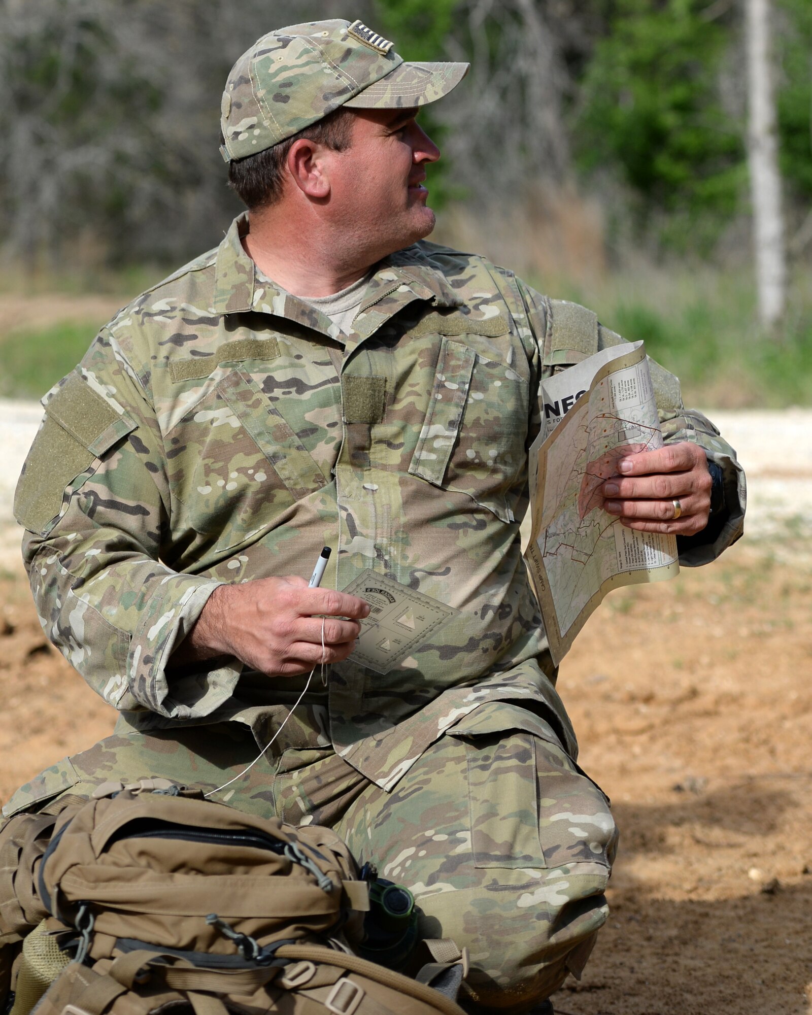 A tactical air control party members with the 147th Air Support Operations Squadron, 147th Reconnaissance Wing, based at Ellington Field Joint Reserve Base in Houston, Texas, prepares to navigate to his first point during a land navigation exercise at Camp Swift in Bastrop, Texas. The squadron travelled to the camp to perform a weeklong field training exercise that allowed the members to maintain their proficiency in their career field.