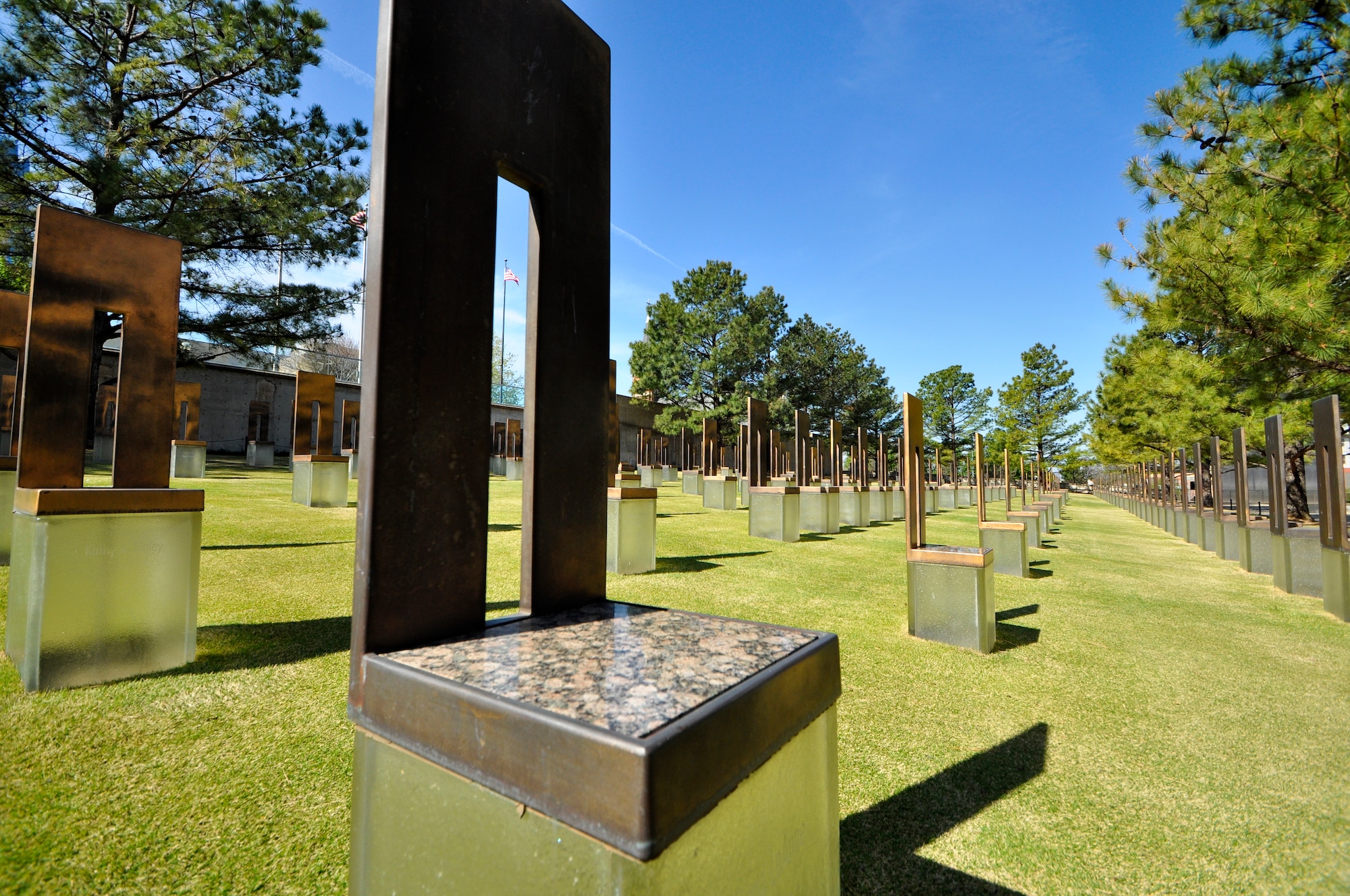 Nineteen years after the bombing of the Alfred P. Murrah Federal Building, The Field of Empty Chairs sits on what was once the footprint of the building.  The 168 empty chairs represent the lives taken on the morning of April 19, 1995.  They stand in nine rows, representing each floor of the building with the name of someone killed on that floor.  Nineteen smaller chairs stand to represent the children who perished that morning.  (U.S. Air Force photo/Senior Airman Mark Hybers)