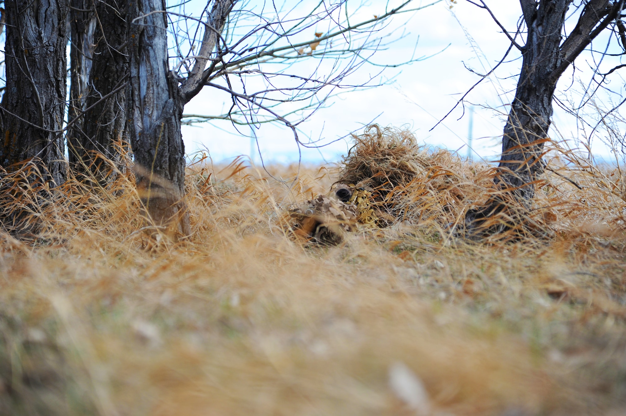 Staff Sgt. Richard Welty, 341st Security Forces Group Tactical Response Force nuclear advanced designated marksman, attempts to reach a pre-determined range so he can engage a simulated enemy target at the Warrior Launch Facility at Malmstrom Air Force Base on April 11. While “stalking,” snipers will make slow, precise movements to get within range of a target to accurately engage or observe the enemy’s movements. (U.S. Air Force photo/Airman 1st Class Joshua Smoot)
