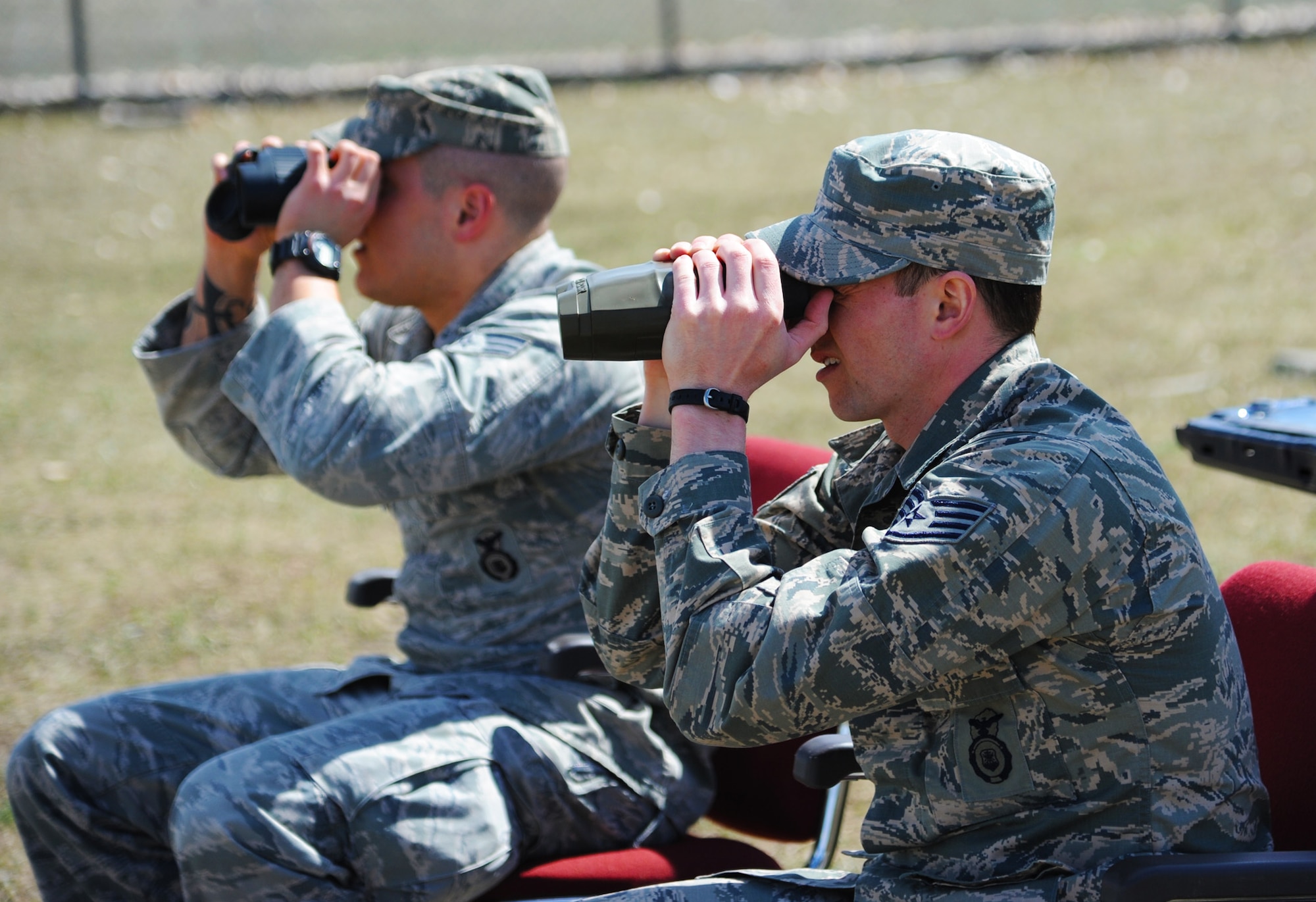 Staff Sgt. Steven Trantham, 341st Security Forces Group Tactical Response Force training NCO in charge (right), and Senior Airman Collin Kleckley, 341st SFG TRF assaulter, attempt to spot two nuclear advanced designated marksmen as they move into position to engage simulated enemy targets. The job of the NADM is to observe enemy forces without being detected and eliminate possible threats while gathering important information on battlefield conditions. (U.S. Air Force photo/Airman 1st Class Joshua Smoot)