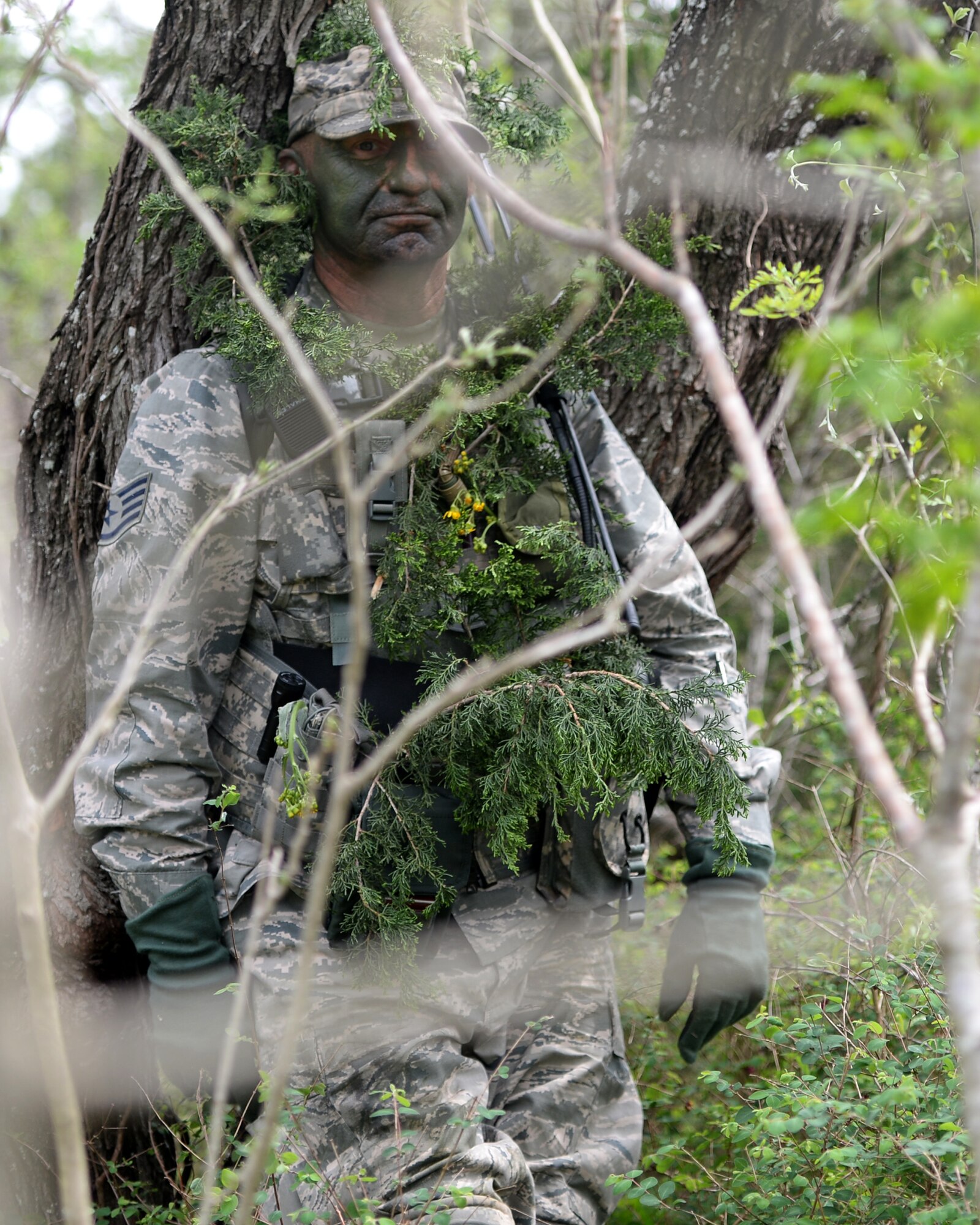 A staff sergeant with the 147th Air Support Operations Squadron, 147th Reconnaissance Wing, based at Ellington Field Joint Reserve Base in Houston, Texas, waits for other members from the squadron to track him during land navigation and vehicle navigation training at the squadron's annual field training exercise April 3, 2014, at Camp Swift in Bastrop, Texas. The support personnel also participated in the annual exercise to test the requirements necessitated by being members of an ASOS unit.