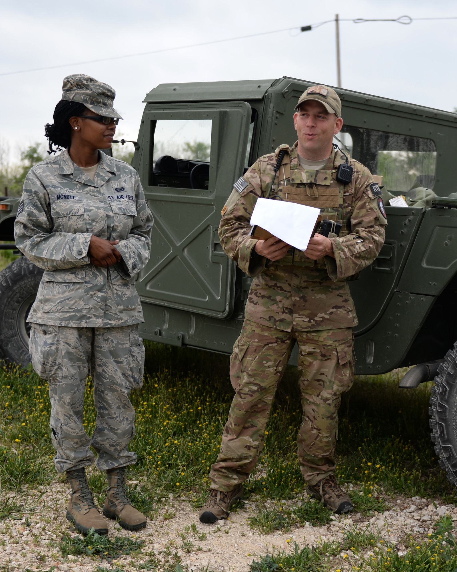 A vehicle maintenance airman with the 147th Air Support Operations Squadron, 147th Reconnaissance Wing, based at Ellington Field Joint Reserve Base in Houston, Texas, reads off waypoints during a field training exercise April 3, 2014, at Camp Swift in Bastrop, Texas. The support personnel participated in the annual exercise to test the requirements necessitated by being members of an ASOS unit.