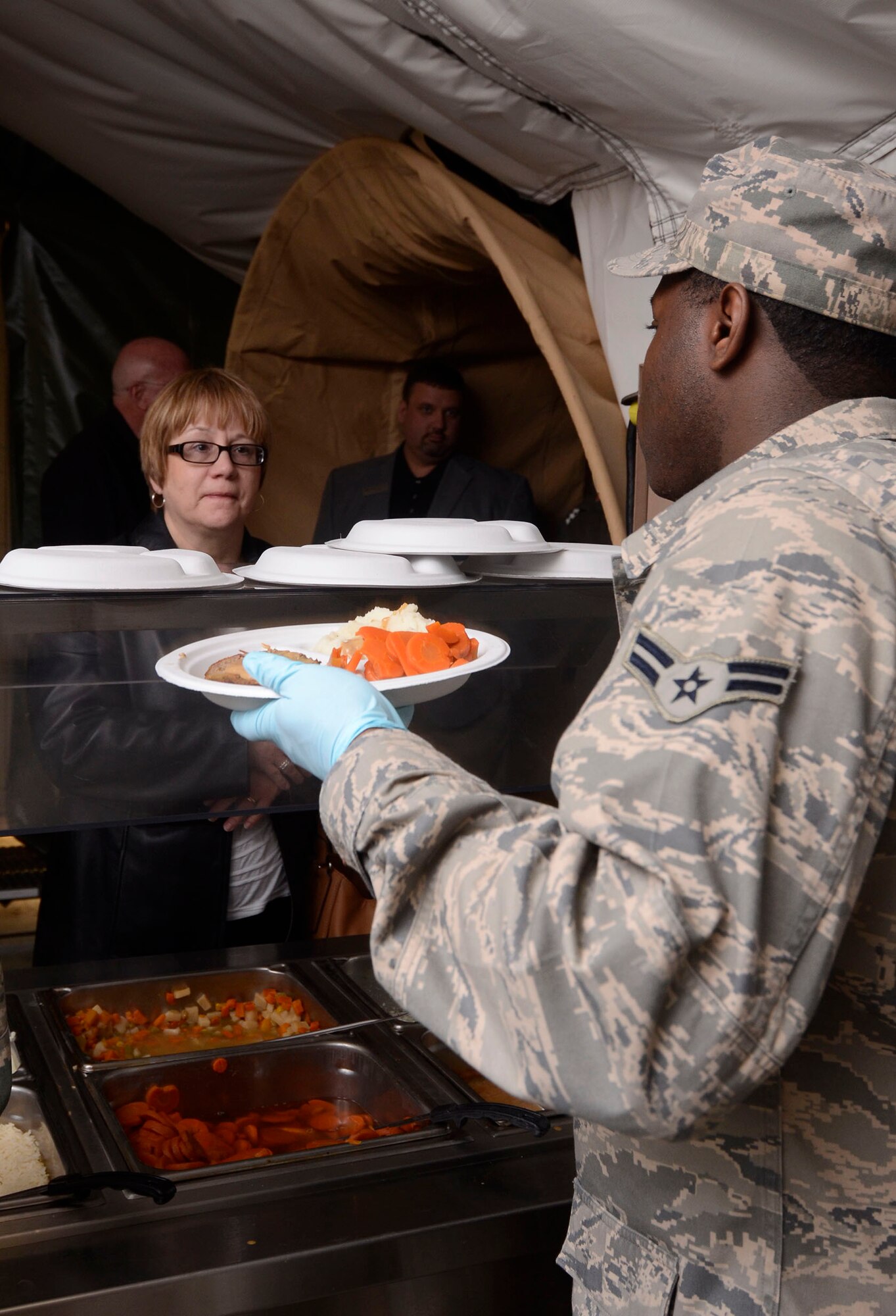 Members of the Leadership Cobb Class of 2014 were treated to lunch in the field provided by students attending the Air Force Reserve Command Force Support Combat School during a base tour at Dobbins Air Reserve Base, Ga. April 16. (U.S. Air Force photo/Don Peek)