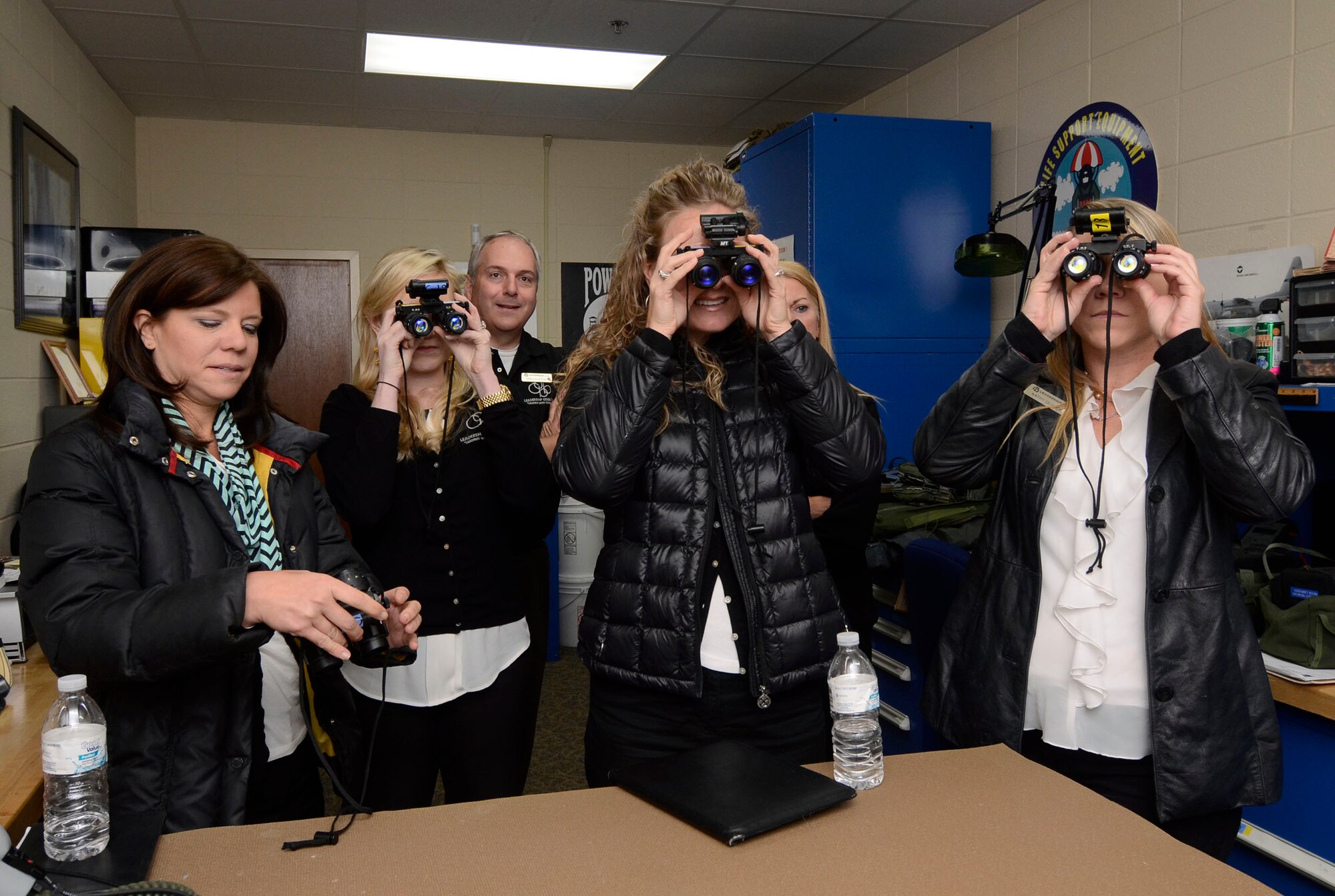Members of the Leadership Cobb Class of 2014 experience a night vision goggle demonstration, while visiting the 700th Airlift Squadron during a tour of Dobbins Air Reserve Base, Ga.  April 16. (U.S. Air Force photo/Don Peek)