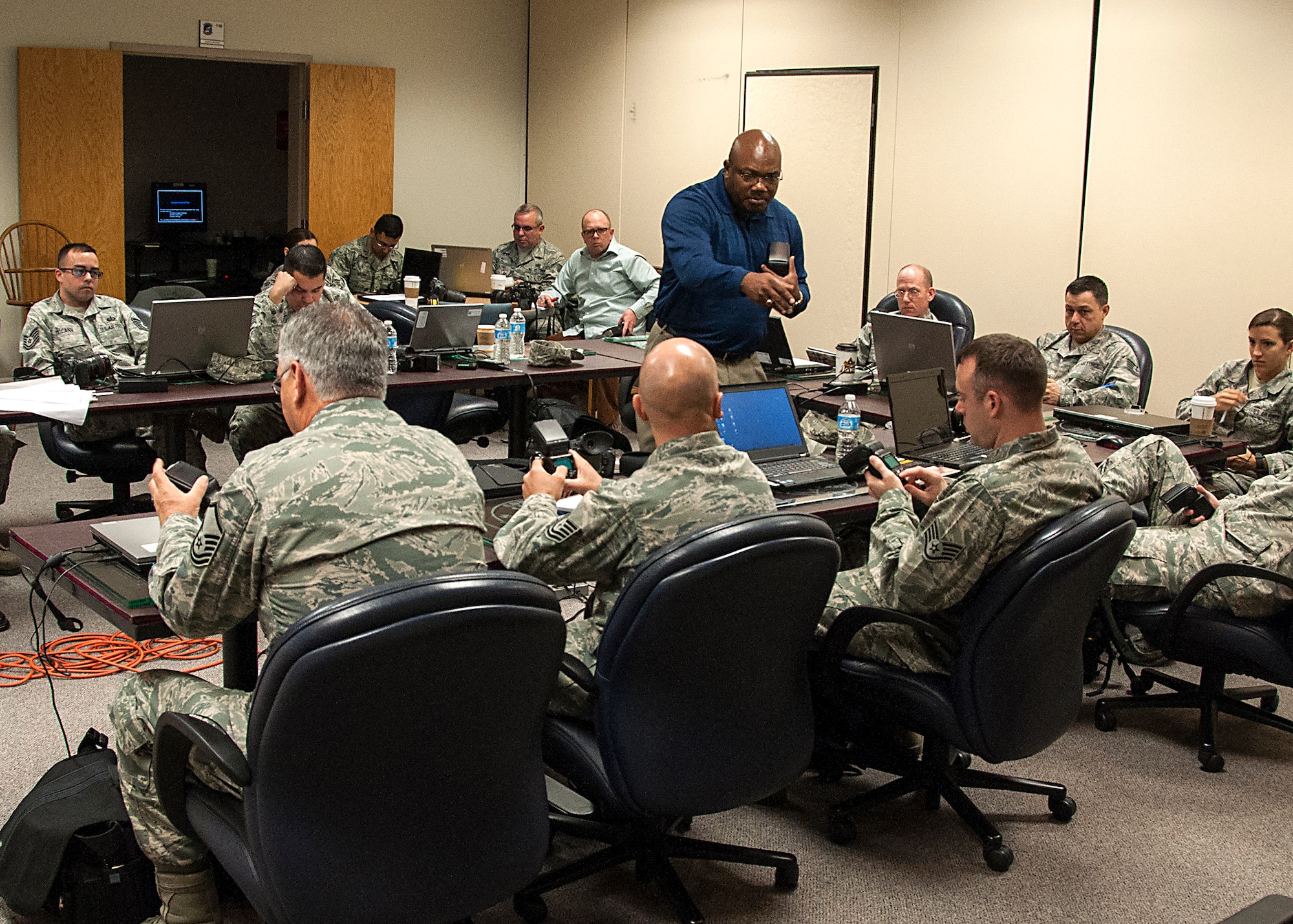Clarence Brown, 1st CCS’s chief of Still Photo Standardization, teaches Reservists how to properly use a flash during a training course with the 1st Combat Camera Squadron this week.  About 23 Air Force Reserve public affairs specialists from bases across the country showed up at Joint Base Charleston with an eagerness to improve their photo skills under the tutelage of some of the Air Force’s most elite photographers – 1st Combat Camera Airmen. (U.S. Air Force Reserve photo by Michael Dukes)