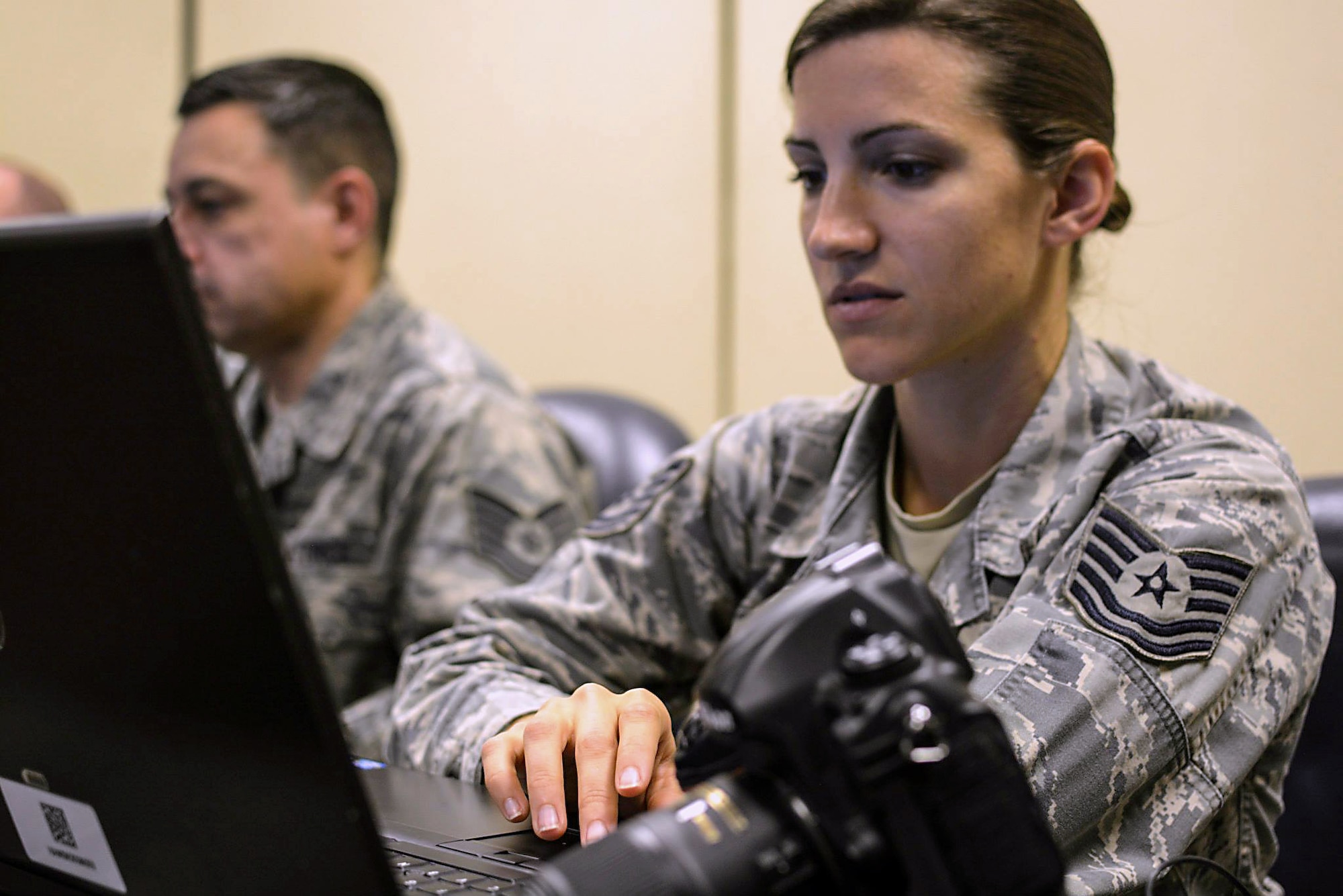 Tech. Sgt. Caroline Hayworth, from 4th Combat Camera Squadron at March Air Reserve Base, Calif., downloads photos she took during  a training course with the 1st Combat Camera Squadron this week. About 23 Air Force Reserve public affairs specialists from bases across the country showed up at Joint Base Charleston with an eagerness to improve their photo skills under the tutelage of some of the Air Force’s most elite photographers – 1st Combat Camera Airmen. (U.S. Air Force Reserve photo by Tech. Sgt. Shane Ellis)