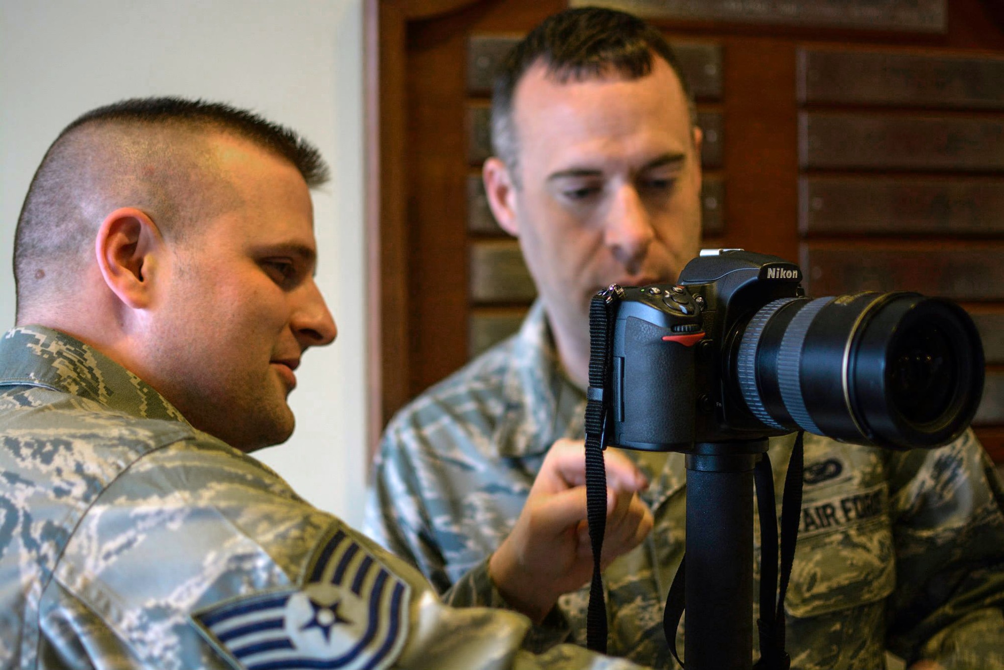 Tech. Sgt. Mark Orders-Woempner and Staff Sgt. Andrew McLaughlin, from 437th Air Refueling Wing at Grissem Air Force Base, Ind. practice newly learned skills during  a training course with the 1st Combat Camera Squadron this week. About 23 Air Force Reserve public affairs specialists from bases across the country showed up at Joint Base Charleston with an eagerness to improve their photo skills under the tutelage of some of the Air Force’s most elite photographers – 1st Combat Camera Airmen. (U.S. Air Force Reserve photo by Tech. Sgt. Shane Ellis)