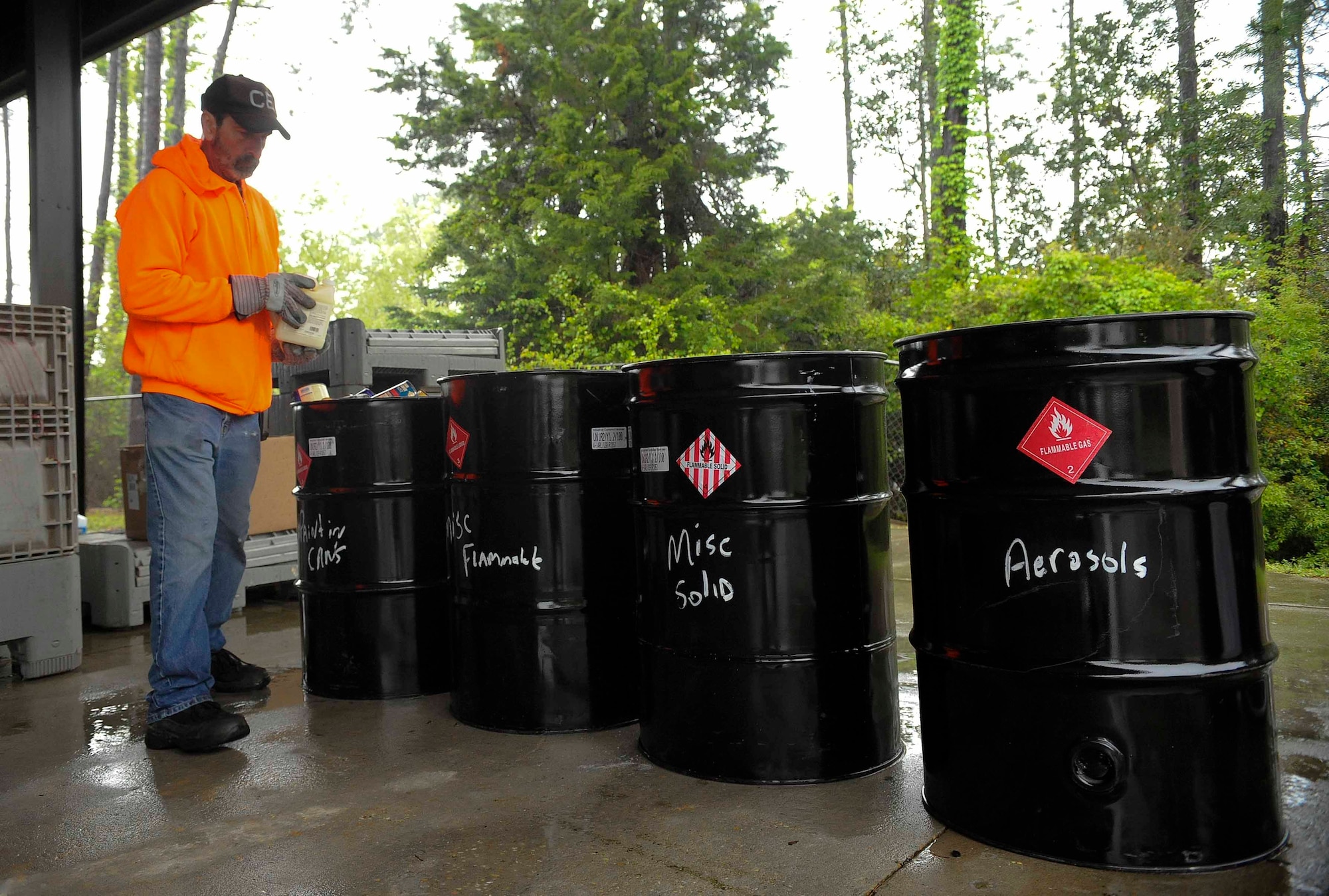 Richard Bowen, environmental company waste manager, sorts household hazardous waste on Hurlburt Field, Fla., April 18, 2014. Tires, explosives, radioactive material, ammunition, bio-medical waste and large appliances were not accepted for this event. (U.S. Air Force photo/Airman 1st Class Andrea Posey)