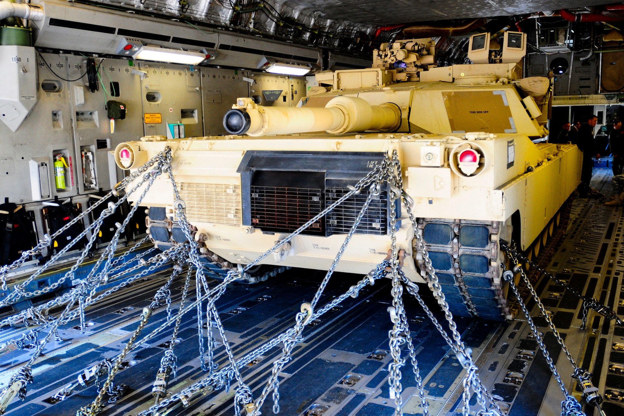 An Army M1A1SA Abrams Main Battle Tank is secure in the cargo area of a 445th Airlift Wing C-17 Globemaster III April 10 at Wright Army Airfield, Ga. Soldiers and Airmen worked in unison over two days to load and secure four of the 1/118th Combat Arms Brigade’s new M1A1SA Abrams Main Battle Tanks onto four C-17s belonging to the 445th AW and the 315th Airlift Wing, Joint Base Charleston, S.C. The tanks were flown to and from McEntire Air National Guard Base, S.C., in support of a tank movement for the 1/118th CAB (Photo by Sgt. Brian Calhoun/Released)