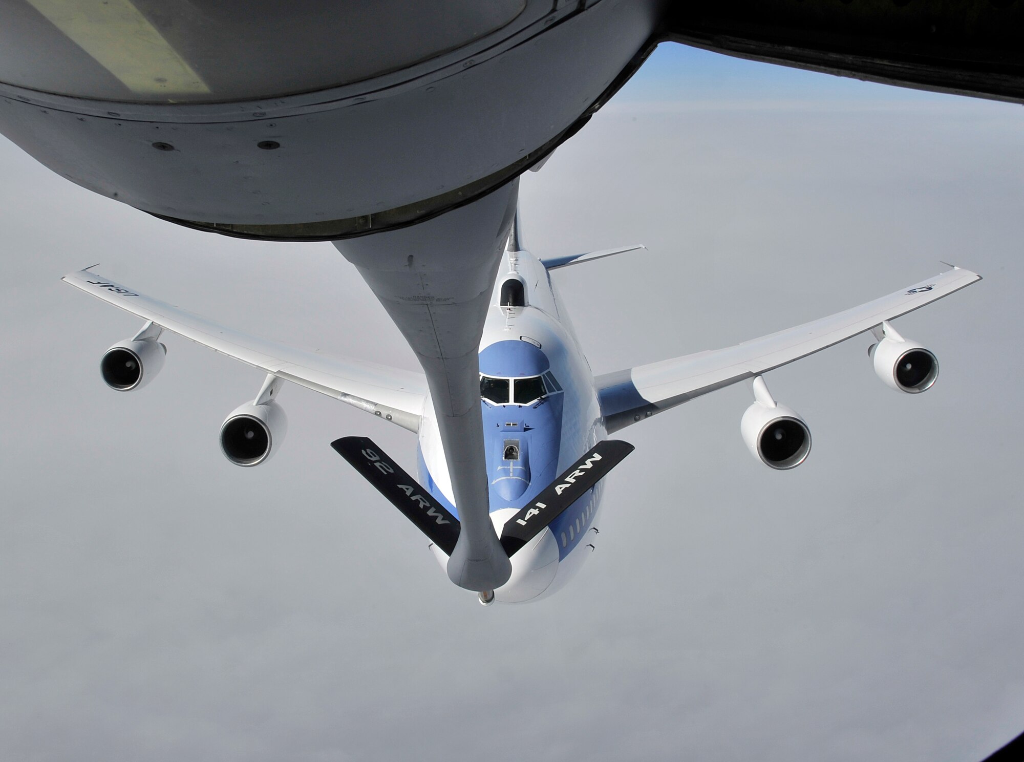 An Air Force E-4B approaches the boom of a KC-135 Stratotanker, assigned to Fairchild Air Force Base, Wash., above the Pacific coast, April 10, 2014. This refueling mission was in support of Secretary of Defense, Chuck Hagel, on his way back to the U.S. from China. (U.S. Air Force photo by Senior Airman Mary O'Dell/Released)