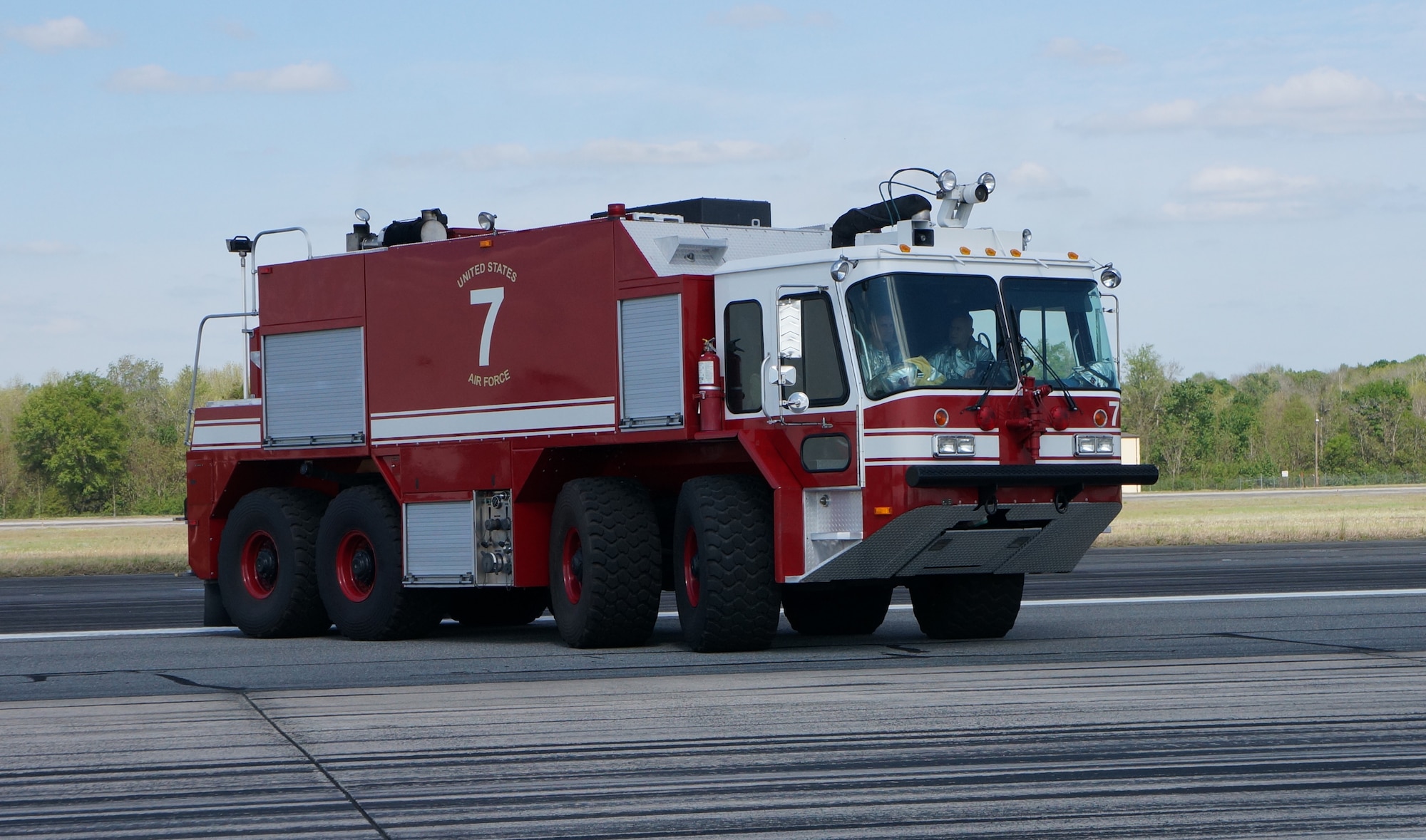 Base firefighters prepare the cable system prior to the F-15 landing at Robins. The use of the system was for a scheduled annual certification engagement, April 8, 2014.(U..S. Air Force photo by Ed Aspera) 
