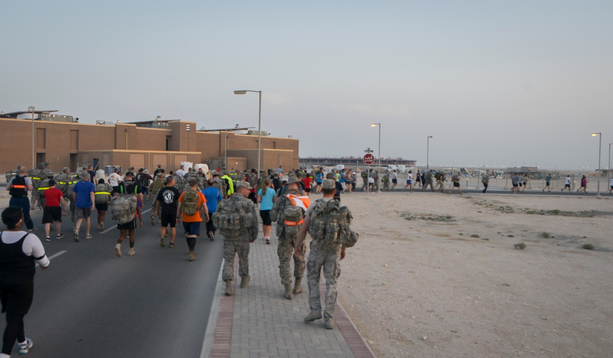 More than 200 Airmen, Marines, Sailors, Soldiers and Department of Defense civilians participated in a Bataan Death March remembrance run, walk and ruck event at Al Udied Air Base, Qatar, April 12, 2014. (U.S. Air Force photo/Senior Airman Jared Trimarchi) 