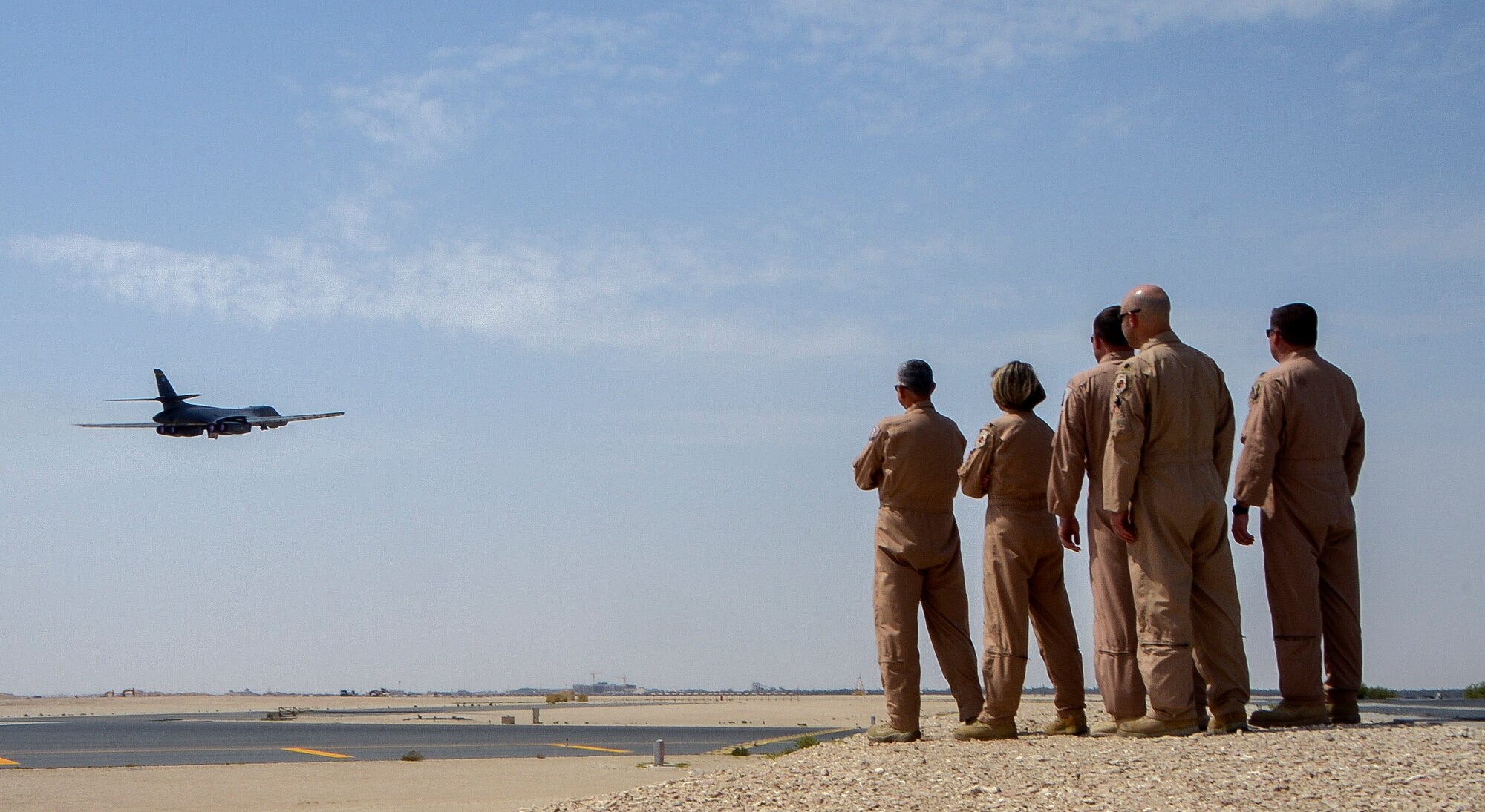 379th Air Expeditionary Wing and 37th Expeditionary Bomb Squadron leadership watch as a B-1B Lancer takes off at Al Udeid Air Base, Qatar, April 18, 2014, in support of Operation Enduring Freedom. Today, the 37th EBS Tigers, one of the squadrons who executed the famous Doolitle Raid over Japan in 1942, will commemorate the event by executing their assigned mission over the skies of Afghanistan. As they fly they remember one of the most inspiring missions of World War II, and one of America’s early steps towards ultimate victory during the war. (U.S. Air Force photo/Senior Airman Jared Trimarchi) 