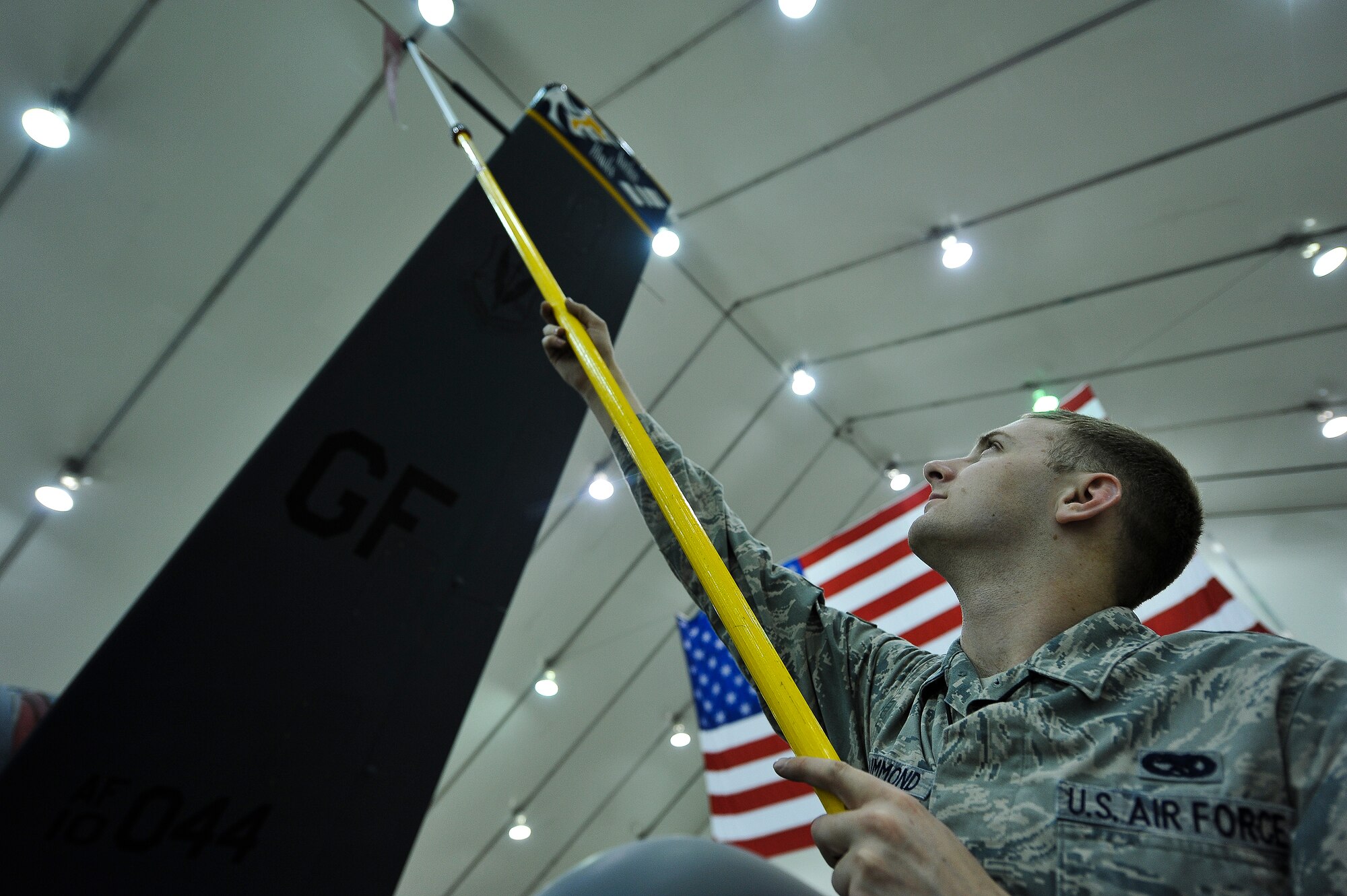 Senior Airman Nicholas McDrummond, a 380th Expeditionary Aircraft Maintenance Squadron avionics specialist, removes a pitot cover on an RQ-4 Global Hawk April 15, 2014, at an undisclosed location in Southwest Asia. The Global Hawk is an unmanned aircraft that provides intelligence, surveillance, reconnaissance and communications capabilities over Southwest Asia. (U.S. Air Force photo by Tech. Sgt. Russ Scalf/Released)