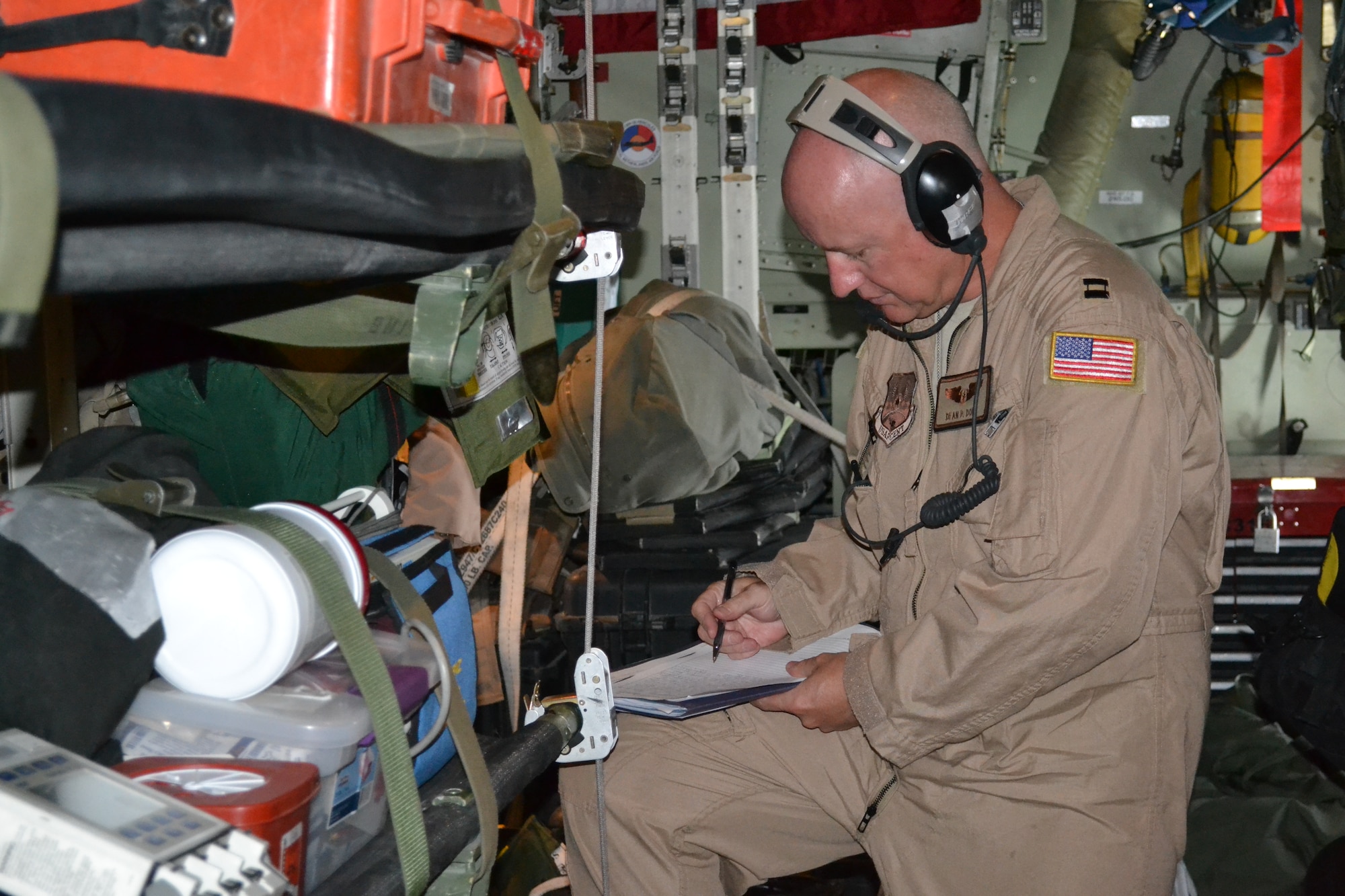 Capt. Dean Dore, a nurse with the 379th Expeditionary Aeromedical Evacuation Squadron, documents  the medical supplies and equipment once configured on the C-130 Hercules prior to an AE mission in support of Operation Enduring Freedom, April 16, 2014, Al Udeid Air Base, Qatar.  A crew of two nurses and three medical technicians inspect all emergency equipment litters and medical supplies prior to loading and configuring it on the aircraft to ensure all power operated equipment is running properly and that they have supplies for any and all types of medical emergencies.  Dore is deployed from Scott Air force Base, Ill. and a Thibodaux, La. native.  (U.S. Air Force photo by Maj. Nicole David) 
