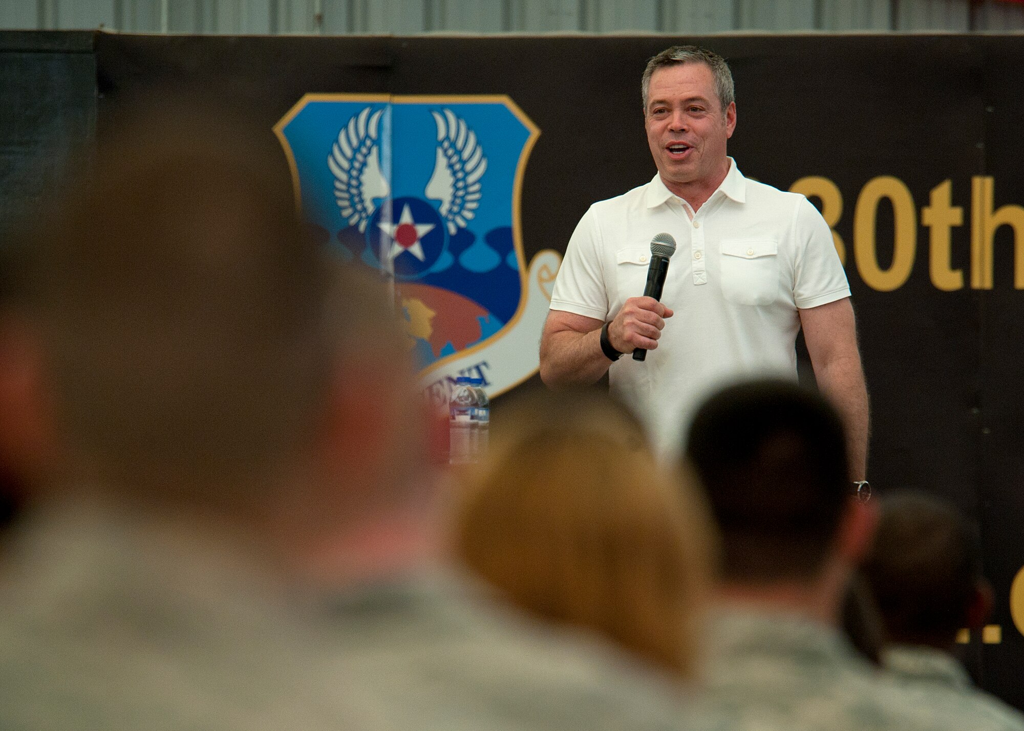 Bernie McGrenaghan performs for deployed Airmen and Soldiers at an undisclosed in Southwest Asia, April 11, 2014. The comedy show was followed by a personal testimony meant to inspire personnel to make smart decisions when drinking alcohol and suicide prevention. (U.S. Air Force photo by Staff Sgt. Michael Means/Released)